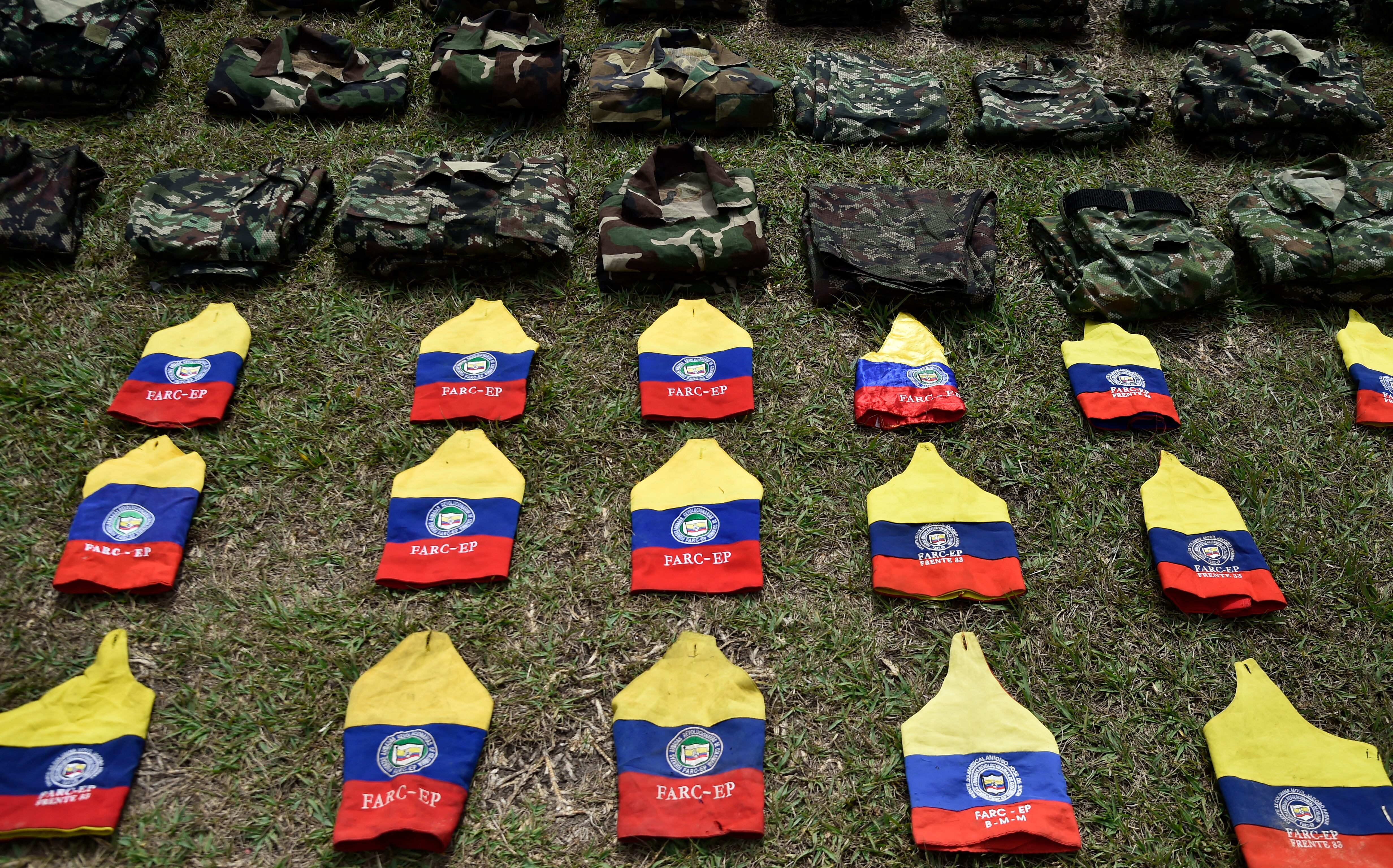 TOPSHOT - Colombian National Army members stand guard during the surrender of weapons by FARC-EP guerrillas, at the San Jorge Military Canton, in Cucuta, Norte de Santander Department, Colombia on January 25, 2025. At least 104 dissidents of the now defunct FARC guerrillas have handed in their weapons to the army amid a bloody offensive launched against them by their ELN enemies in a region of northeastern Colombia, a senior military commander said. (Photo by Schneyder Mendoza / AFP) (Photo by SCHNEYDER MENDOZA/AFP via Getty Images)