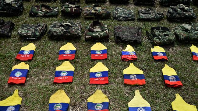 TOPSHOT - Colombian National Army members stand guard during the surrender of weapons by FARC-EP guerrillas, at the San Jorge Military Canton, in Cucuta, Norte de Santander Department, Colombia on January 25, 2025. At least 104 dissidents of the now defunct FARC guerrillas have handed in their weapons to the army amid a bloody offensive launched against them by their ELN enemies in a region of northeastern Colombia, a senior military commander said. (Photo by Schneyder Mendoza / AFP) (Photo by SCHNEYDER MENDOZA/AFP via Getty Images)