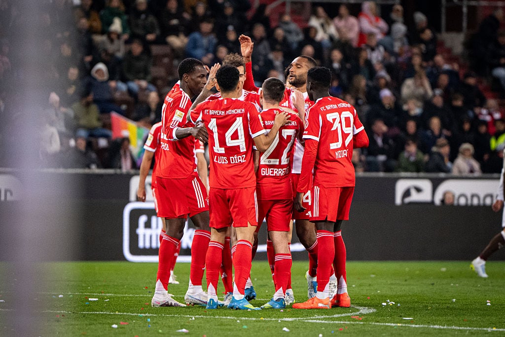 HAMBURG, GERMANY - APRIL 11: Players of FC Bayern Muenchen celebrate after Raphael Guerreiro scores his team's fifth goal during the Bundesliga match between FC St. Pauli and FC Bayern München at Millerntor Stadium on April 11, 2026 in Hamburg, Germany. (Photo by S. Mellar/FC Bayern via Getty Images)