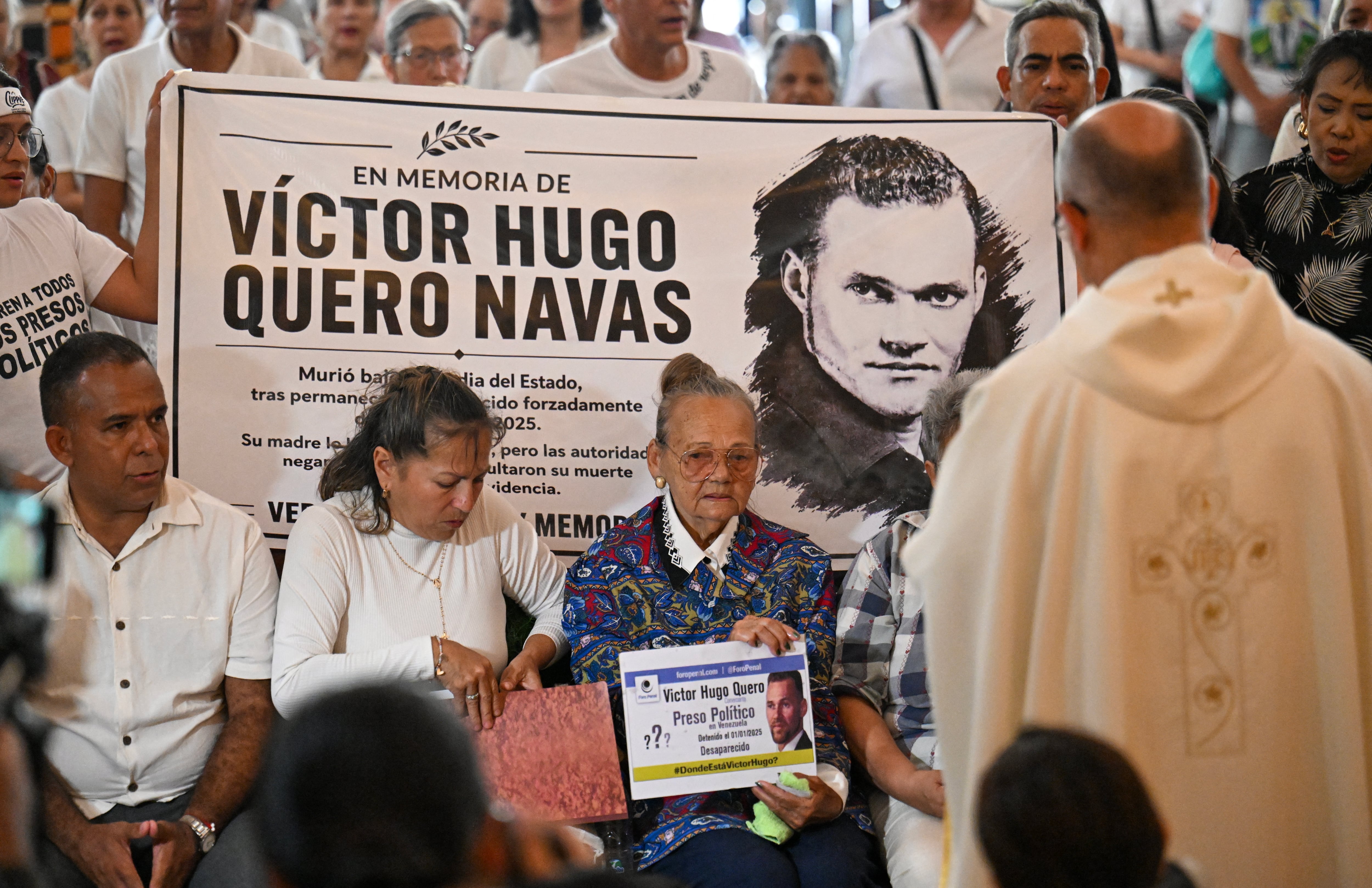 Carmen Navas (3rd L), the mother of the late political prisoner Victor Quero Navas, attends a mass in his honor in Caracas on May 15, 2026. Venezuela's prisons ministry last May 7 acknowledged the death in custody of political prisoner Victor Hugo Quero Navas, 51, nearly a year after his passing and after his mother spent months searching for him. (Photo by Juan BARRETO / AFP)