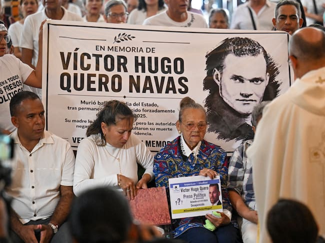 Carmen Navas (3rd L), the mother of the late political prisoner Victor Quero Navas, attends a mass in his honor in Caracas on May 15, 2026. Venezuela's prisons ministry last May 7 acknowledged the death in custody of political prisoner Victor Hugo Quero Navas, 51, nearly a year after his passing and after his mother spent months searching for him. (Photo by Juan BARRETO / AFP)