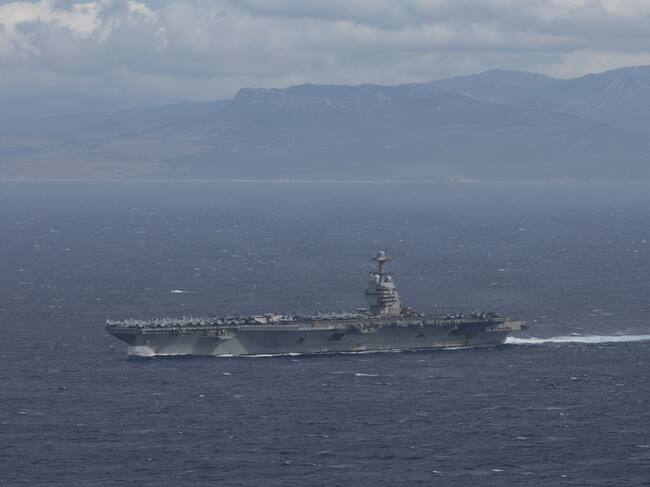 The world's largest aircraft carrier, USS Gerald R. Ford (CVN 78), transits the Strait of Gibraltar, Nov. 4, 2025. Gerald R. Ford, a first-in-class aircraft carrier and deployed flagship of Carrier Strike Group 12, is on a scheduled deployment in the U.S. 6th Fleet area of operations to support the warfighting effectiveness, lethality and readiness of U.S. Naval Forces Europe-Africa, and defend U.S., Allied and partner interests in the region. (U.S. Navy photo by Mass Communication Specialist 2nd Class Triniti Lersch)