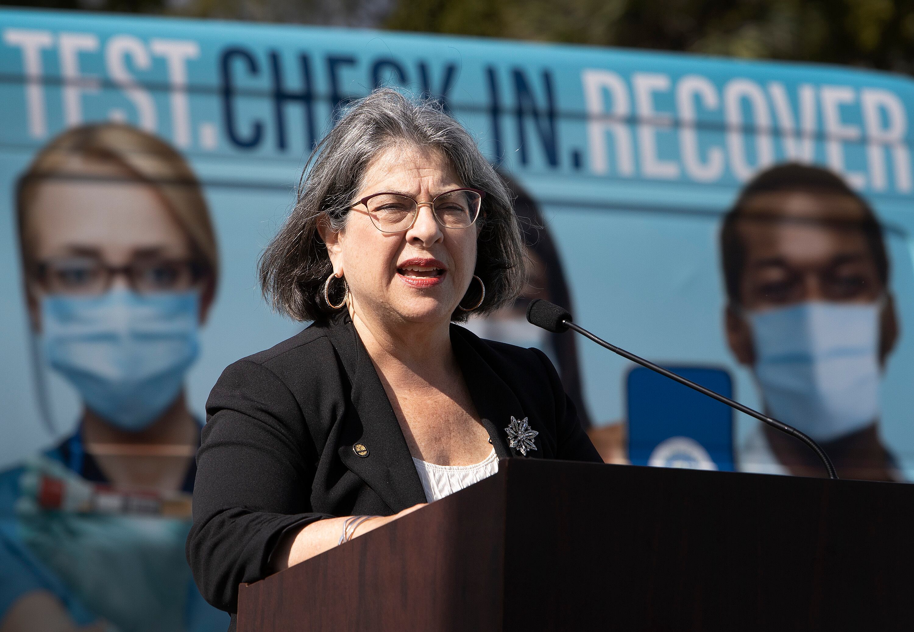 MIAMI, FLORIDA - DECEMBER 16: Miami-Dade County Mayor Daniella Levine Cava speaks to the media about the need for South Floridians to be safe during the holidays at a drive-thru COVID-19 vaccination site on December 16, 2021 in Miami, Florida.  Mayor Levine Cava visited the vaccination site located in Tropical Park to encourage residents to take holiday gatherings outside this year, get tested for COVID-19, and get vaccinated. (Photo by Joe Raedle/Getty Images)