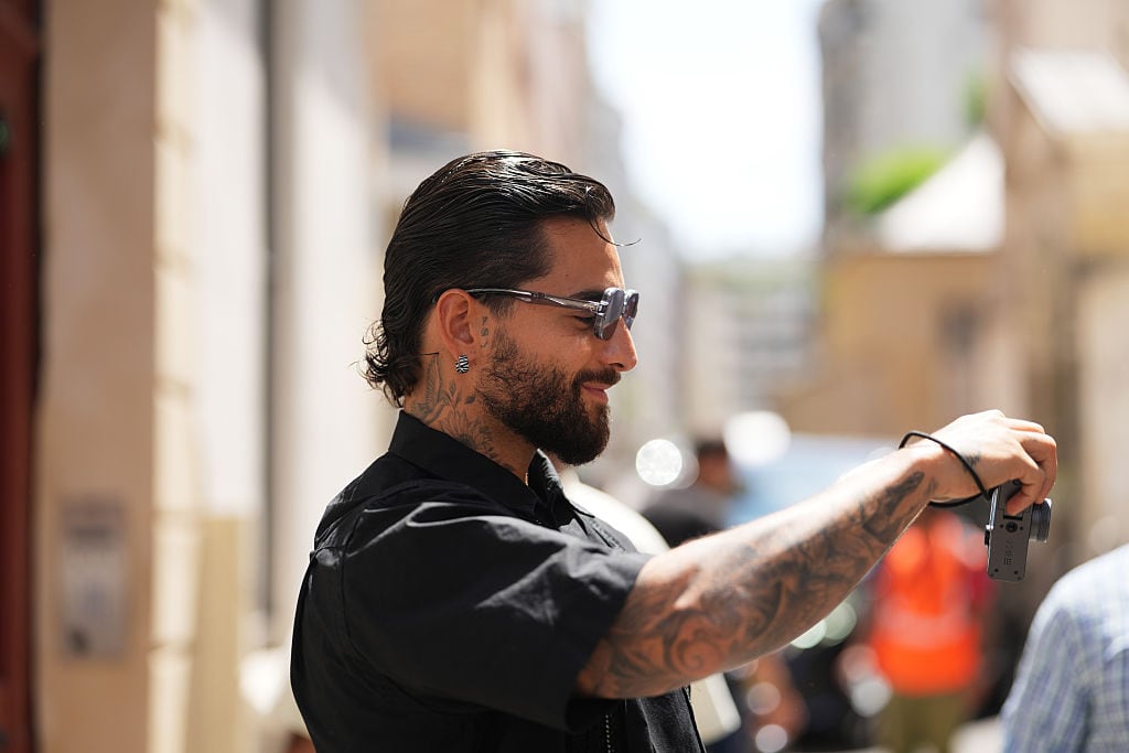 PARIS, FRANCE - JUNE 28: Maluma attends the Sacai Menswear Spring/Summer 2027 show as part of Paris Fashion Week on June 28, 2026 in Paris, France. (Photo by Edward Berthelot/Getty Images)