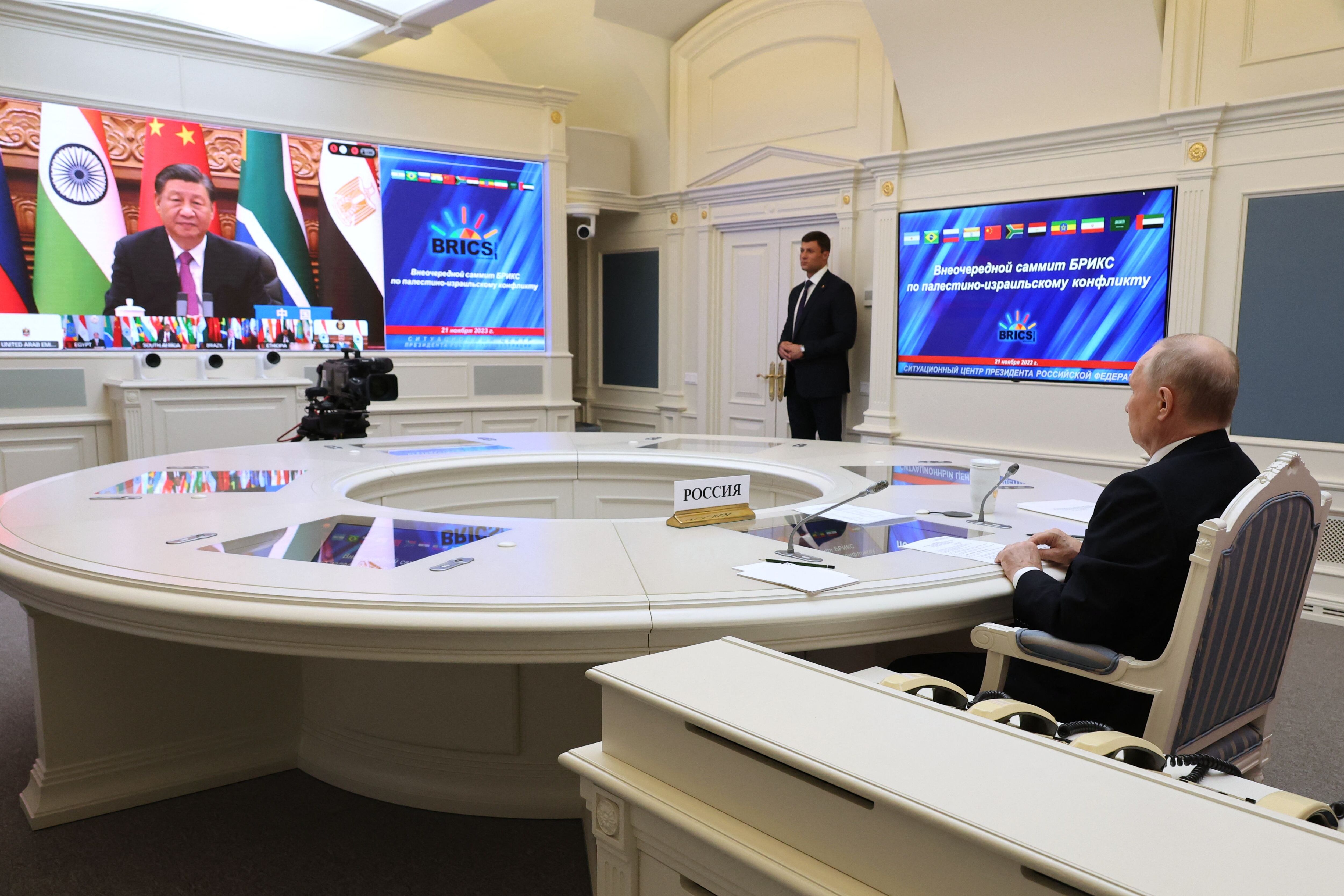 This pool photograph distributed by Russian state agency Sputnik shows Russia's President Vladimir Putin attending a virtual summit of the BRICS group of nations (the bloc that includes Brazil, Russia, India, China and South Africa) to discuss the Israel-Hamas war, in Moscow on November 21, 2023. (Photo by Alexander KAZAKOV / POOL / AFP) (Photo by ALEXANDER KAZAKOV/POOL/AFP via Getty Images)