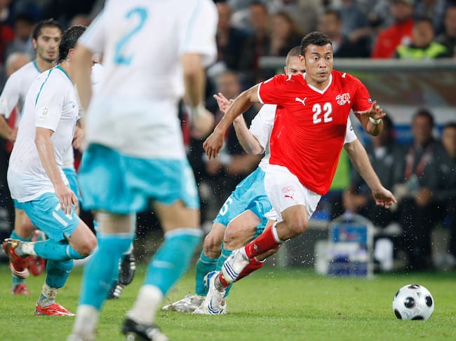 , AUSTRIA - JUNE 11: Emre Asik of Turkey , Johan Vonlanthen of Switzerland during the EURO match between Switzerland v Turkey on June 11, 2008 (Photo by Eric Verhoeven/Soccrates/Getty Images)