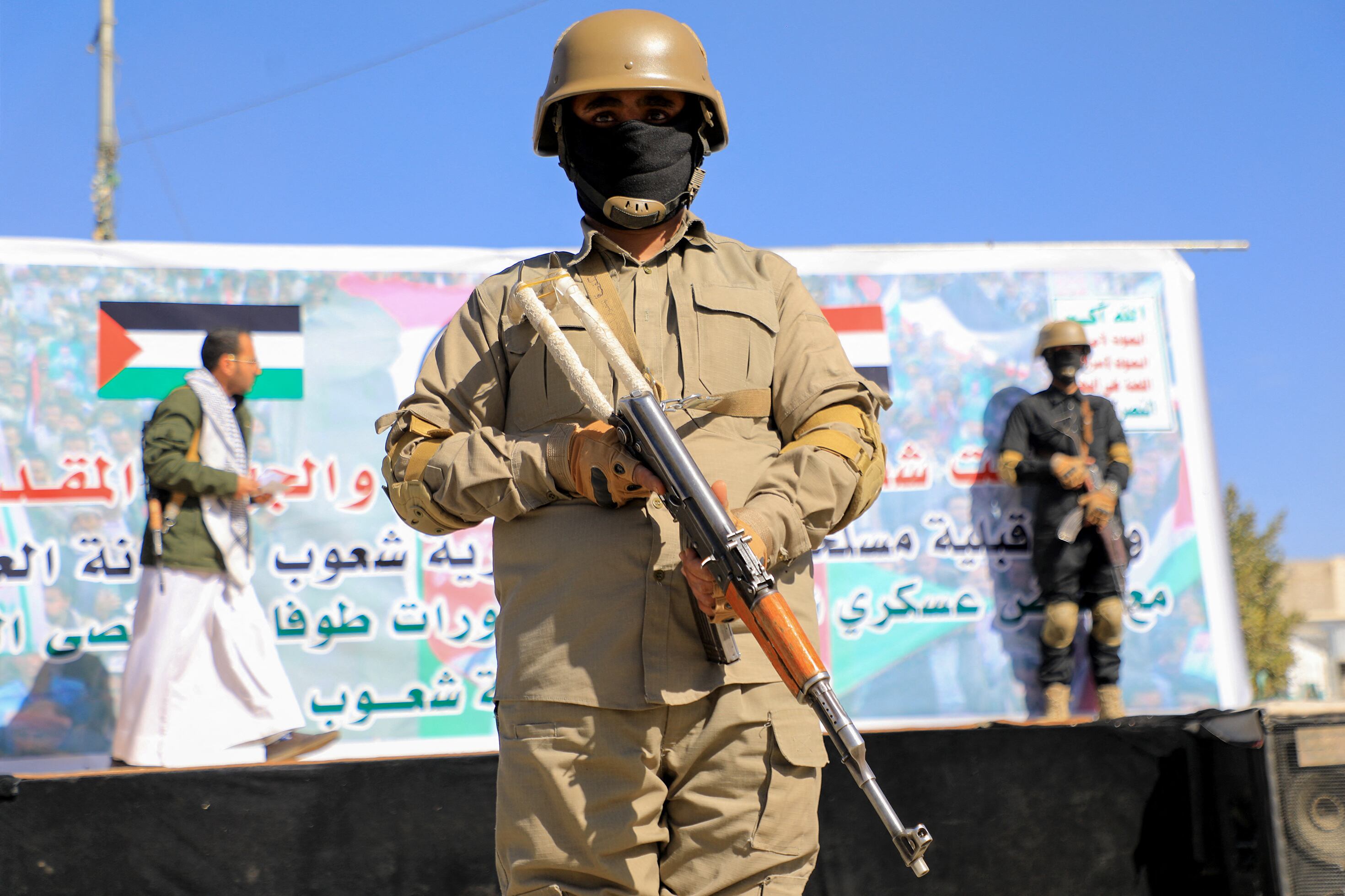 Yemeni Huthi-affiliated security forces stand guard during a protest in solidarity with the Palestinian people in the Huthi-controlled Yemeni capital Sanaa on January 5, 2024, amid the ongoing battles between Israel and the militant Hamas group in Gaza. Heavy air strikes pounded rebel-held cities in Yemen early on January 12, 2024, the Huthi rebels' official media and AFP correspondents said. The capital Sanaa, Hodeida and Saada were all targeted, the Huthis' official media said, blaming "American aggression with British participation". (Photo by MOHAMMED HUWAIS / AFP) (Photo by MOHAMMED HUWAIS/AFP via Getty Images)