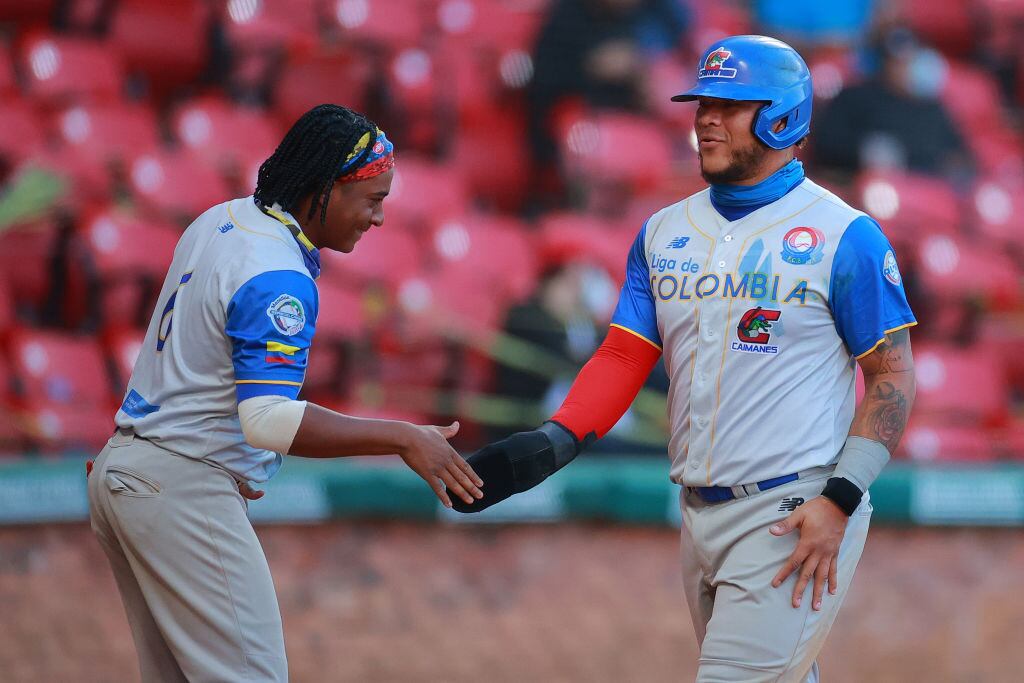 MAZATLAN, MEXICO - FEBRUARY 04: Harlod Ramirez #47 of Caimanes de Barranquilla of Colombia celebrates after scoring on the 5th inning during the game between Colombia and Dominican Republic as part of Serie del Caribe 2021 at Teodoro Mariscal Stadium on February 04, 2021 in Mazatlan, Mexico. (Photo by Hector Vivas/Getty Images)