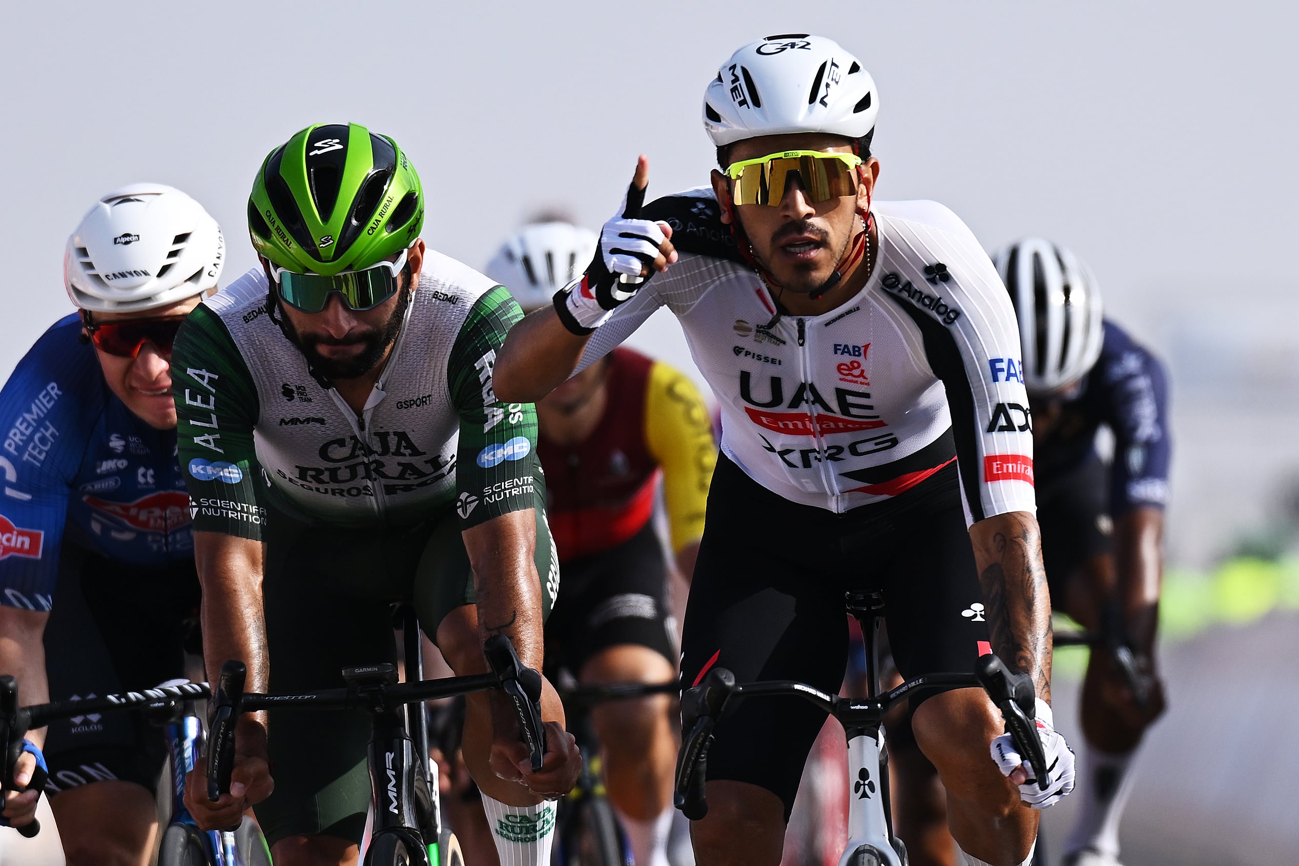 BIMMAH SINKHOLE, OMAN - FEBRUARY 07: Juan Sebastian Molano of Colombia and UAE Team Emirates (R) celebrates at finish line as stage winner ahead of Fernando Gaviria of Colombia and Team Caja Rural-Seguros RGA (C) and Gerben Thijssen of Belgium and Team Alpecin-Premier Tech (L) during the 15th Tour of Oman 2026, Stage 1 a 170.9km stage from Ministry of Tourism to Bimmah Sink Hole on February 07, 2026 in Bimmah sinkhole, Oman. (Photo by Dario Belingheri/Getty Images)