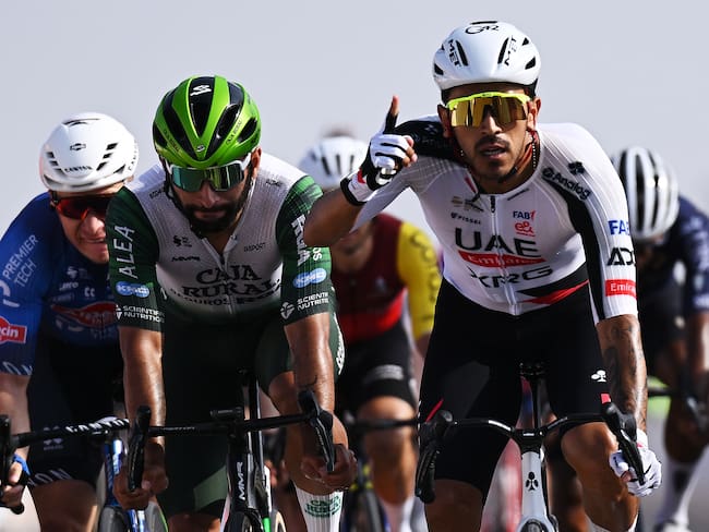 BIMMAH SINKHOLE, OMAN - FEBRUARY 07: Juan Sebastian Molano of Colombia and UAE Team Emirates (R) celebrates at finish line as stage winner ahead of Fernando Gaviria of Colombia and Team Caja Rural-Seguros RGA (C) and Gerben Thijssen of Belgium and Team Alpecin-Premier Tech (L) during the 15th Tour of Oman 2026, Stage 1 a 170.9km stage from Ministry of Tourism to Bimmah Sink Hole on February 07, 2026 in Bimmah sinkhole, Oman. (Photo by Dario Belingheri/Getty Images)