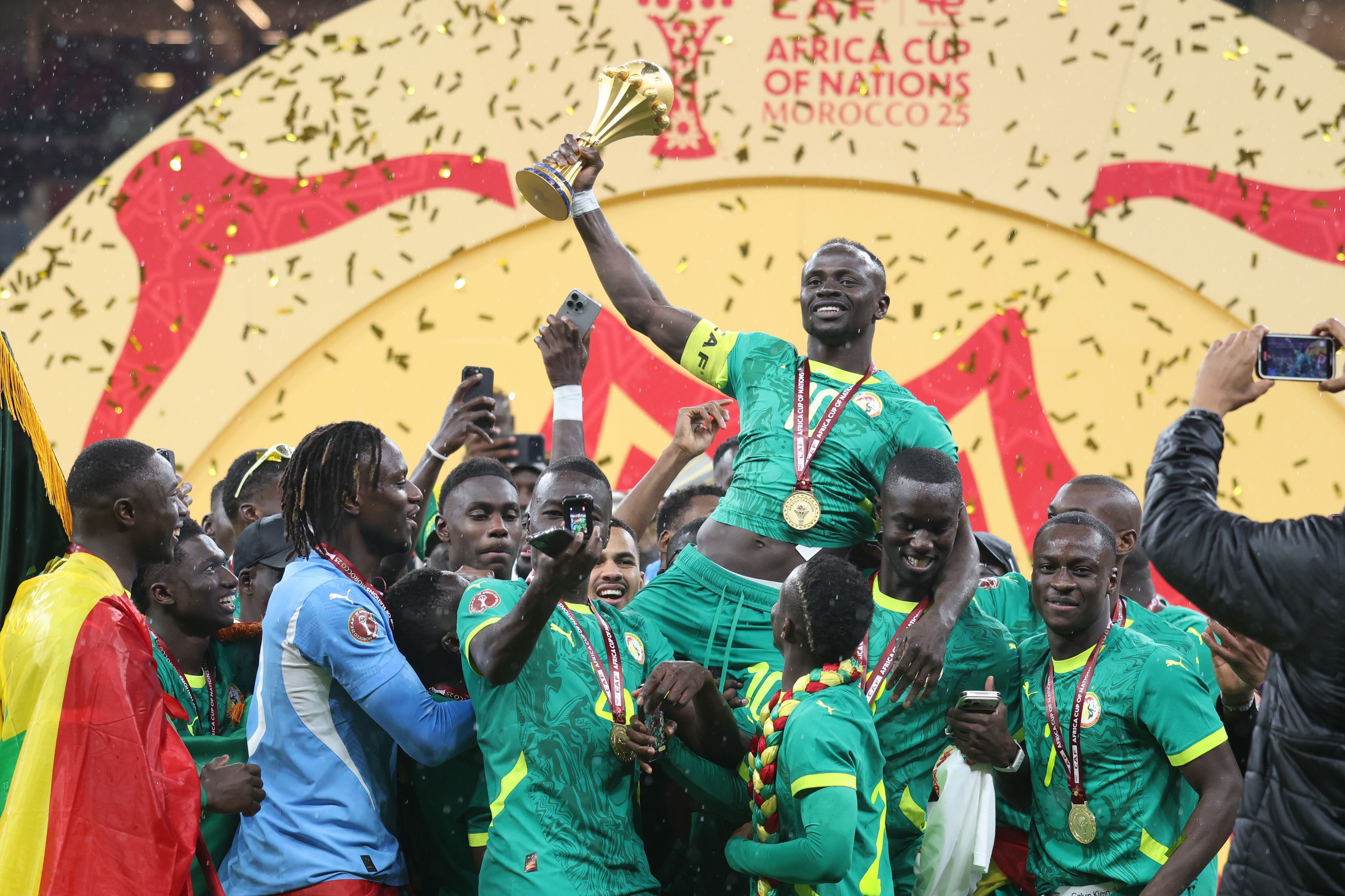 RABAT, MOROCCO - JANUARY 19: Senegalese players raise the trophy after winning the 35th Africa Cup of Nations (AFCON 2025) final match against Morocco at the Prince Moulay Abdellah Stadium in the capital Rabat, Morocco on January 19, 2026. Senegal won the 35th Africa Cup of Nations title on Sunday, defeating hosts Morocco 1-0 after extra time in a dramatic final marked by lengthy stoppage-time scenes. (Photo by Samah Zidan/Anadolu via Getty Images)