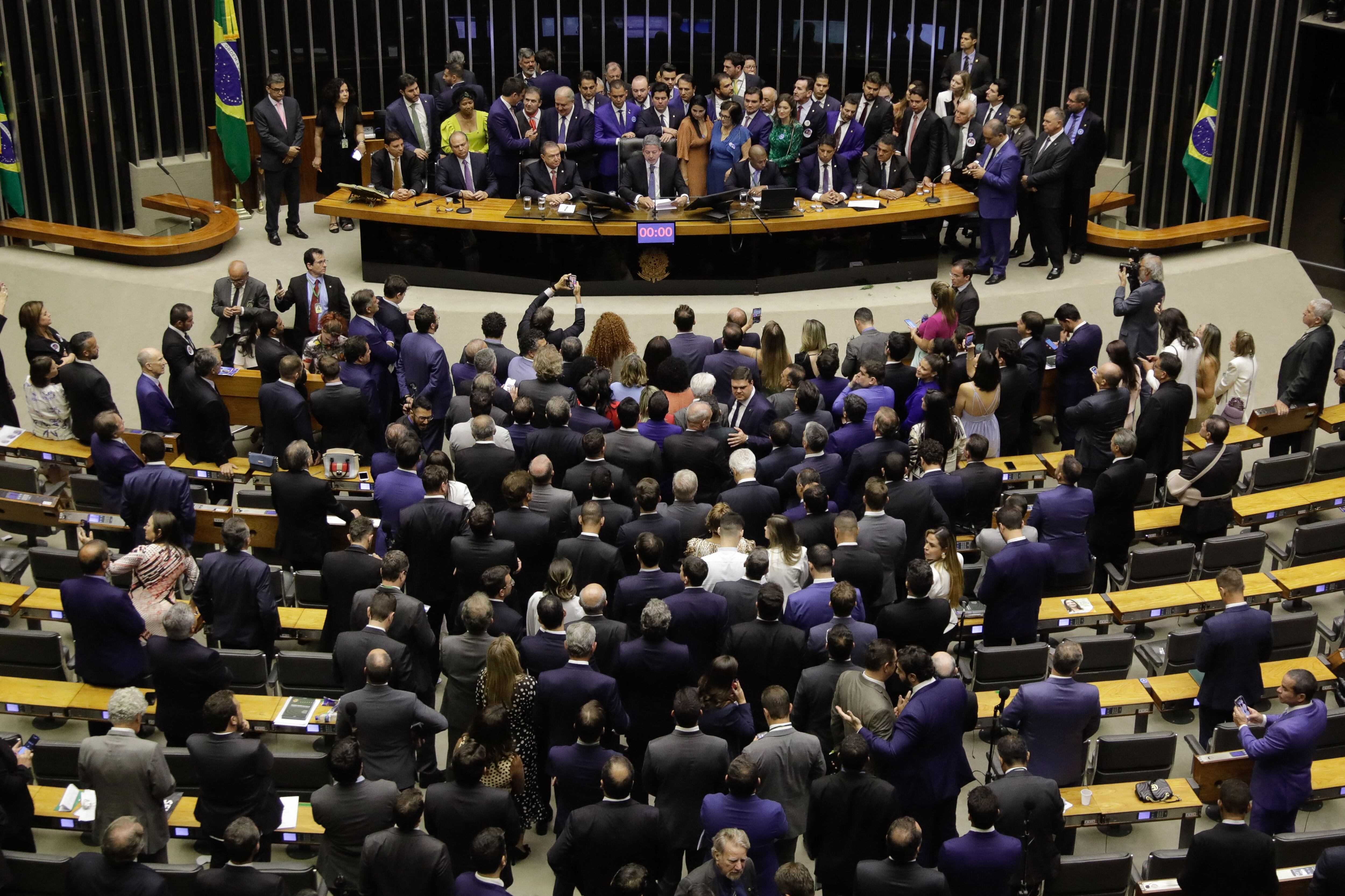 Brazilian deputy Arthur Lira (C) speaks after being re-elected as President of the Chamber of Deputies at the National Congress in Brasilia, on February 1, 2023. (Photo by Sergio Lima / AFP) (Photo by SERGIO LIMA/AFP via Getty Images)