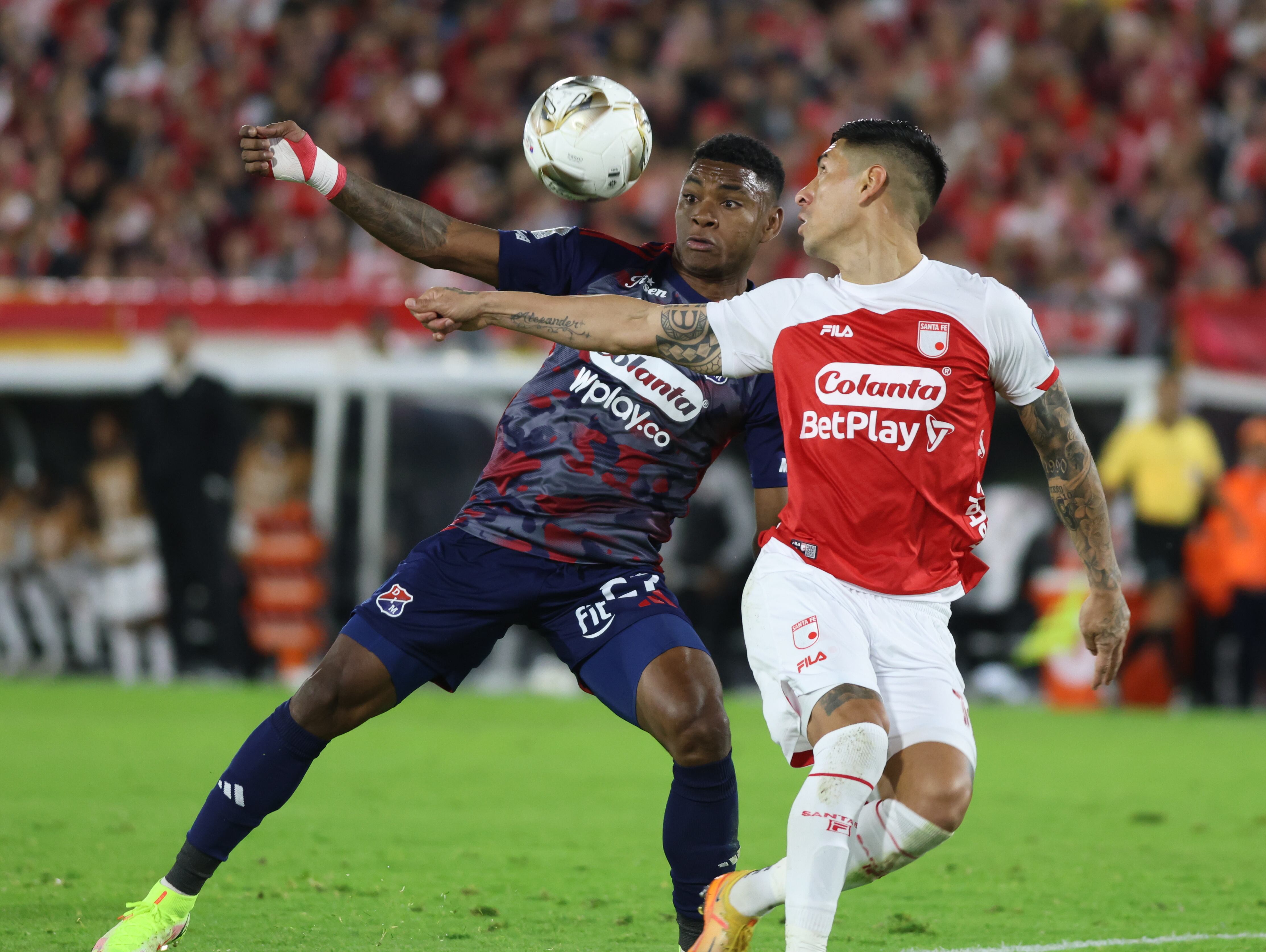 Brayan Leon from Deportivo Independiente Medellin and Emmanuel Olivera from Independiente Santa Fe fight for the ball during the game between Independiente Santa Fe and Deportivo Independiente Medellin Final Ida, as part of the Betplay Dimayor I 2025 League, at the Nemesio Camacho El Campin El Campin de Bogota stadium. (Photo by Daniel Garzon Herazo/NurPhoto via Getty Images)