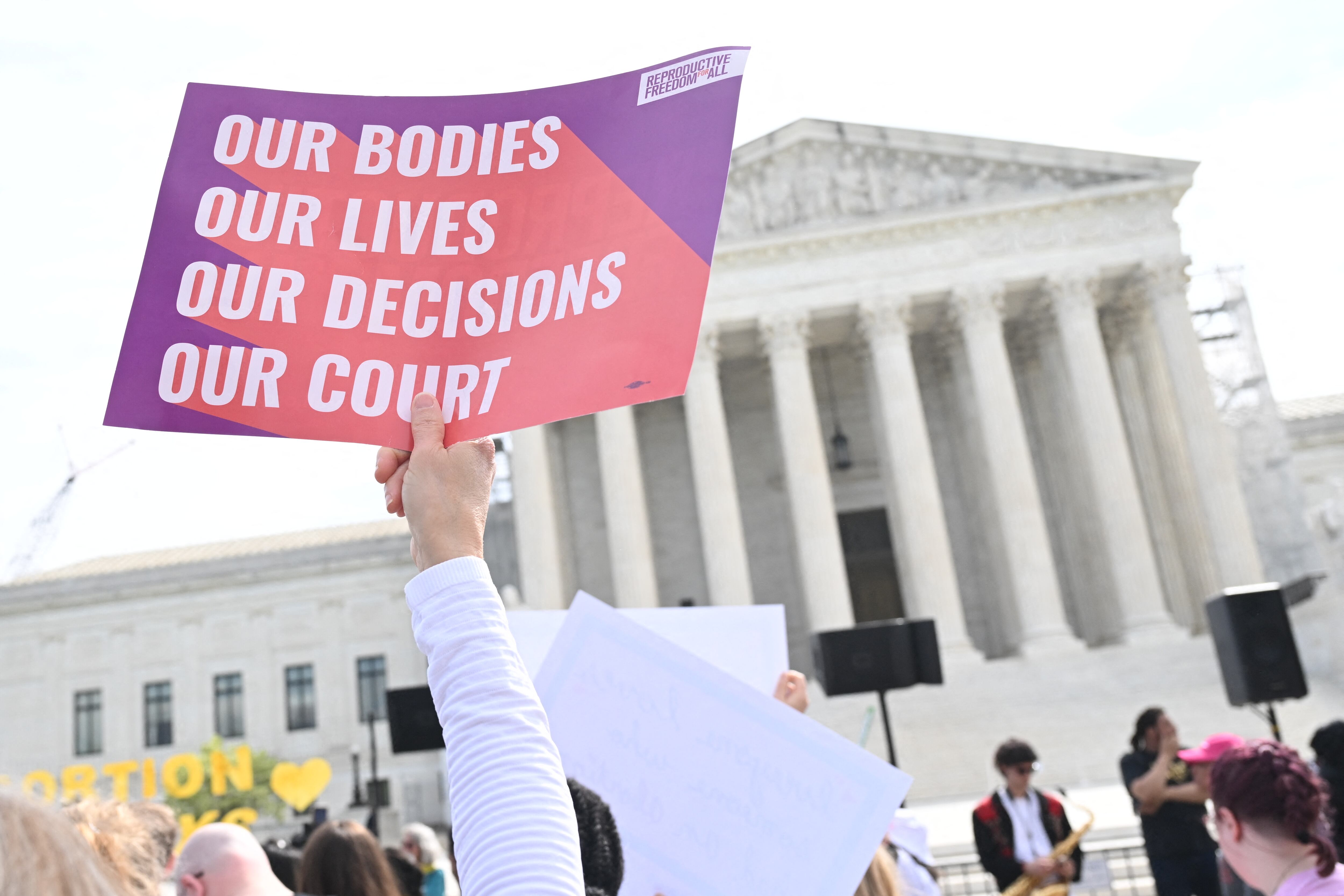 Pro-abortion activists rally for "reproductive rights and emergency abortion care" outside the US Supreme Court as it hears arguments in the Moyle v. United States case, in Washington, DC, on April 24, 2024. - The case deals with whether an Idaho abortion law conflicts with the federal Emergency Medical Treatment and Labor Act (EMTALA). (Photo by SAUL LOEB / AFP)