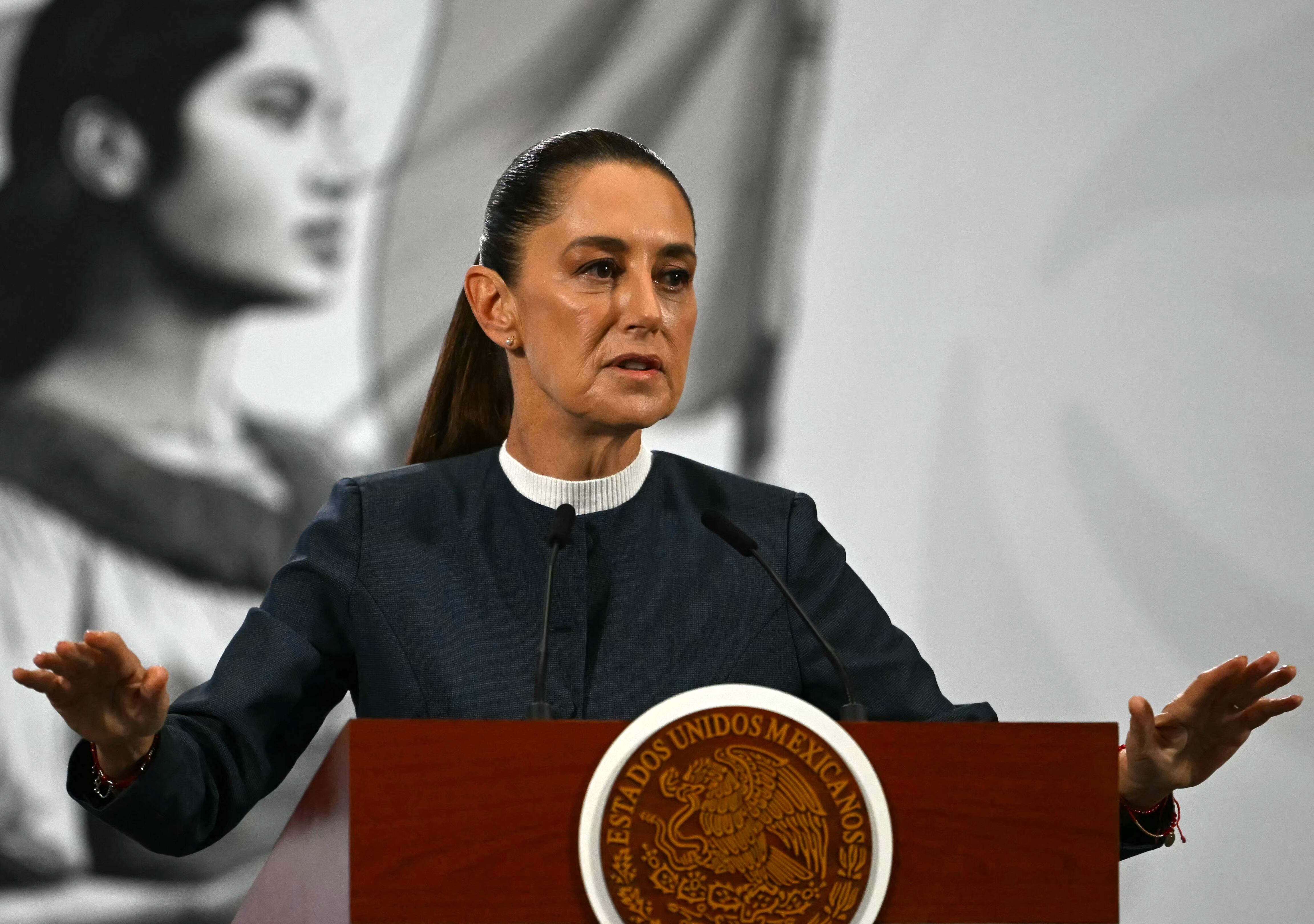 Mexico's President Claudia Sheinbaum speaks during her daily press conference where she announced progress in the organization of the upcoming FIFA 2026 World Cup, at Palacio Nacional in Mexico City on November 3, 2025. (Photo by CARL DE SOUZA / AFP)