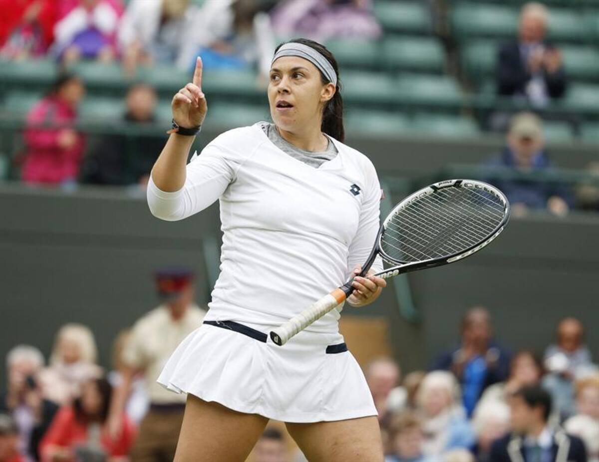 La tenista francesa Marion Bartoli reacciona durante el partido de cuartos de final del torneo de tenis de Wimbledon.