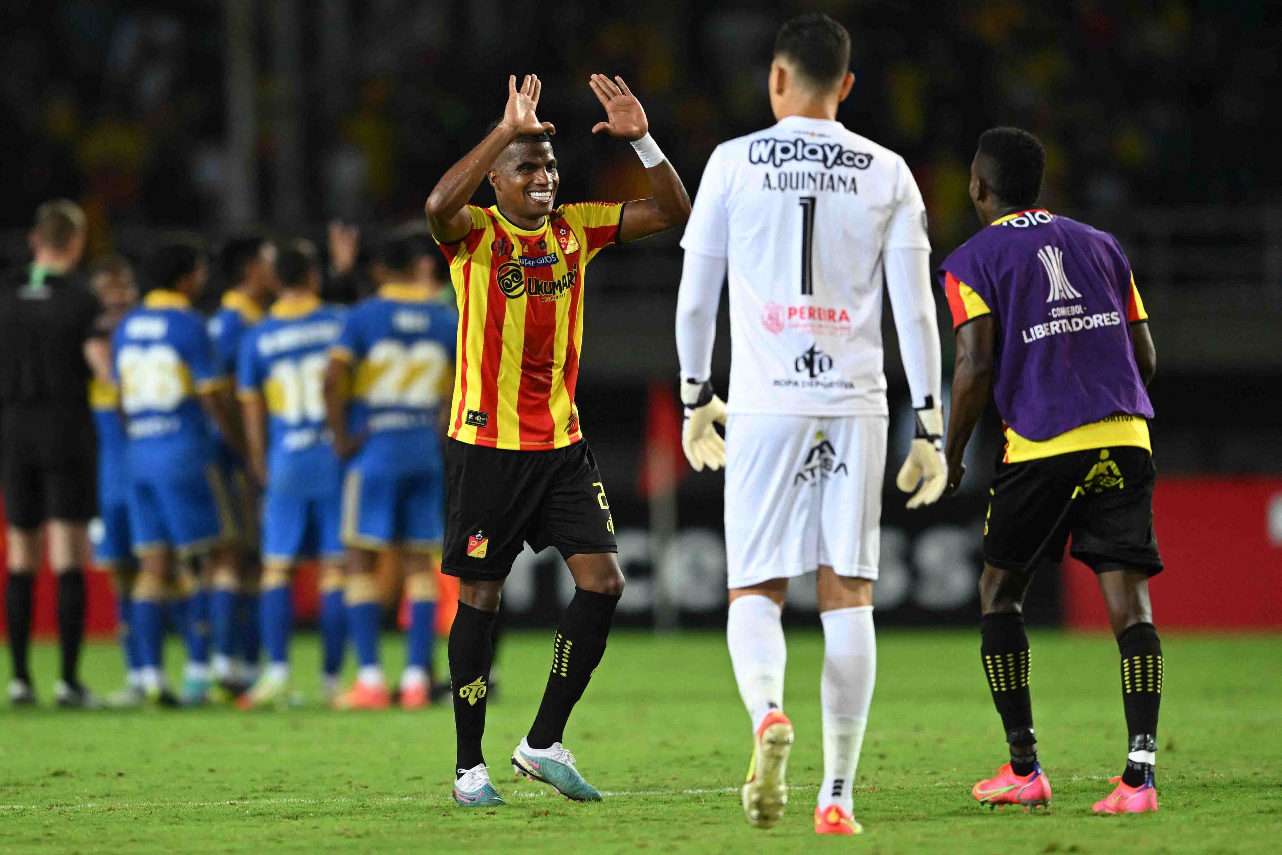 Players of Deportivo Pereira celebrate their victory after the end of the Copa Libertadores group stage second leg football match between Colombia's Deportivo Pereira and Argentina's Boca Juniors, at the Hernán Ramírez Villegas stadium, in Pereira, Colombia, on May 24, 2023. (Photo by Raul ARBOLEDA / AFP) (Photo by RAUL ARBOLEDA/AFP via Getty Images)