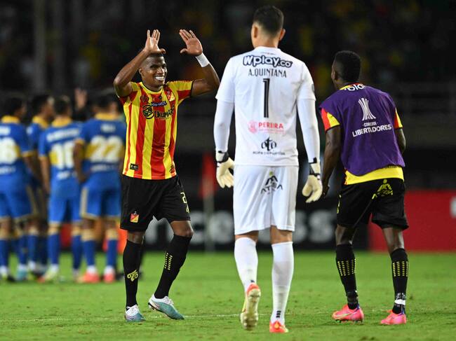 Players of Deportivo Pereira celebrate their victory after the end of the Copa Libertadores group stage second leg football match between Colombia's Deportivo Pereira and Argentina's Boca Juniors, at the Hernán Ramírez Villegas stadium, in Pereira, Colombia, on May 24, 2023. (Photo by Raul ARBOLEDA / AFP) (Photo by RAUL ARBOLEDA/AFP via Getty Images)