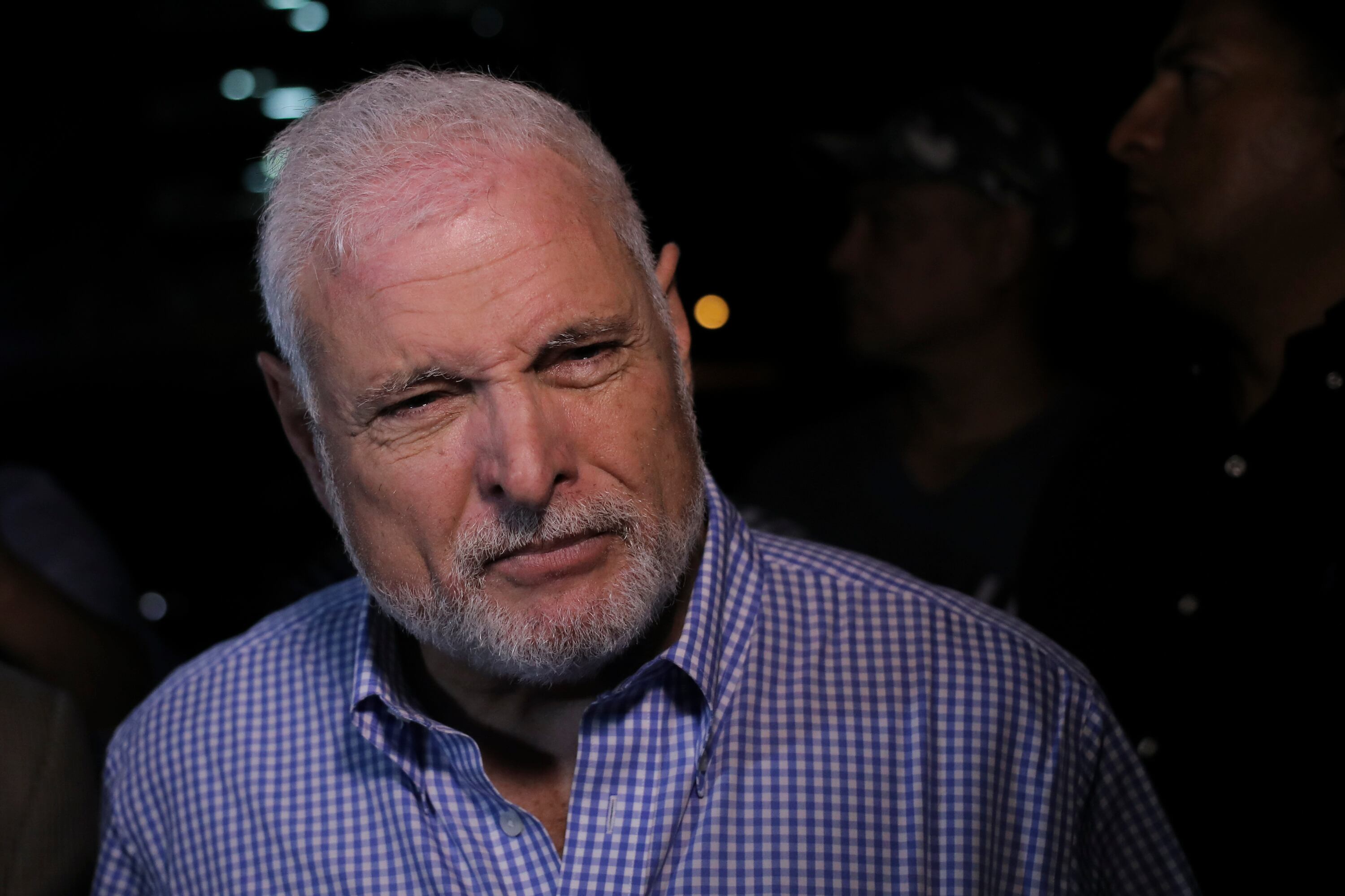Panama's former president Ricardo Martinelli (C), detained a year ago on illegal wiretapping charges, talks to the media after being declared innocent in Panama City, on August 9, 2019. - A Panama court acquitted former president Ricardo Martinelli on August 9 on charges of political espionage and embezzlement of public funds. (Photo by Mauricio VALENZUELA / AFP)        (Photo credit should read MAURICIO VALENZUELA/AFP via Getty Images)