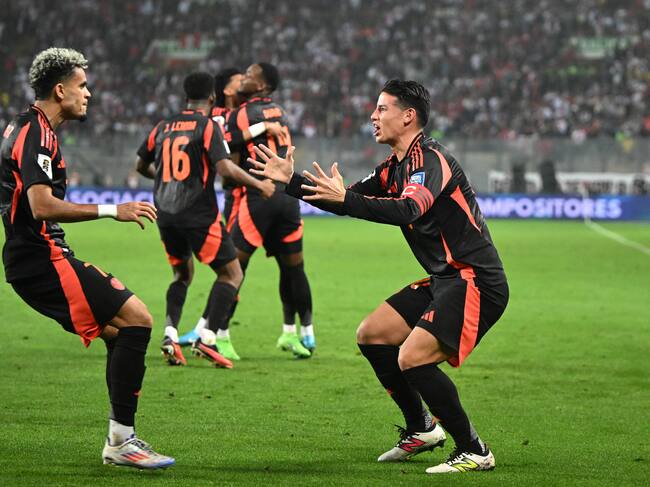 TOPSHOT - Colombia's forward Luis Diaz (L) celebrates with teammate midfielder James Rodriguez after scoring during the 2026 FIFA World Cup South American qualifiers football match between Peru and Colombia, at the Monumental stadium in Lima, on September 6, 2024. (Photo by ERNESTO BENAVIDES / AFP) (Photo by ERNESTO BENAVIDES/AFP via Getty Images)
