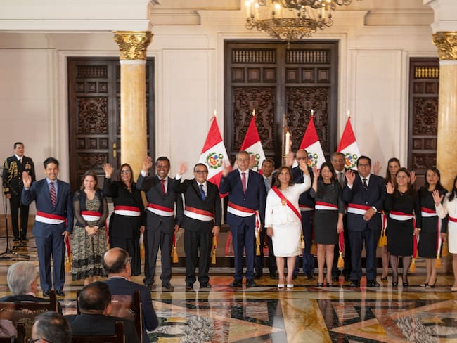 Peru&#039;s new President, Dina Boluarte (C), poses for a picture with her newly appointed cabinet ministers after the swearing-in ceremony at the Palace of Government in Lima on December 10, 2022. - The head of Peru&#039;s legislature called on December 10, 2022, on the country&#039;s new leader Dina Boluarte to appoint a new cabinet urgently amid continuing street protests following the removal of Pedro Castillo as president. (Photo by Cris BOURONCLE / AFP) (Photo by CRIS BOURONCLE/AFP via Getty Images)