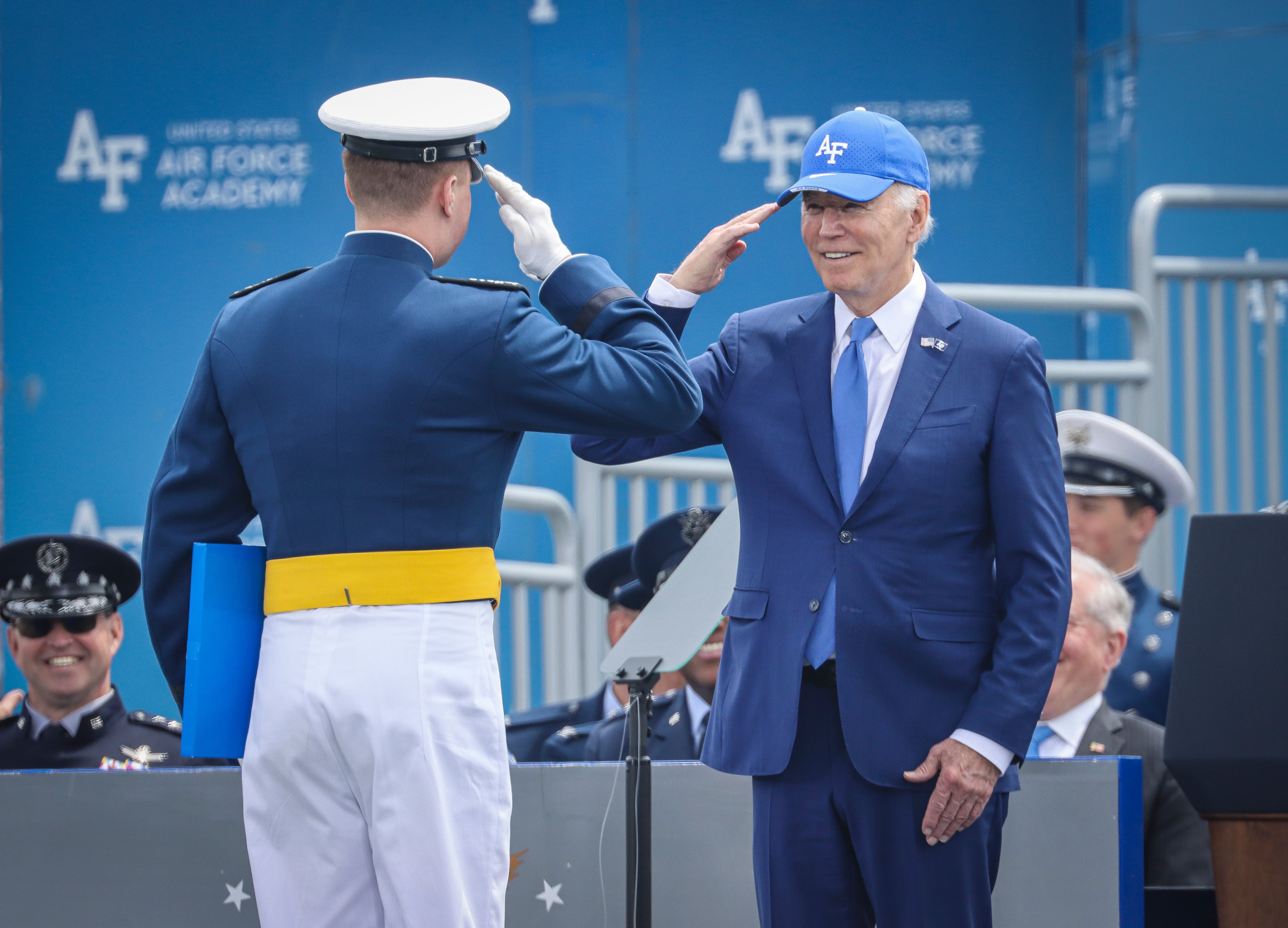 COLORADO SPRINGS, COLORADO - JUNE 1: President Joe Biden salutes an Air Force Academy cadet during graduation on June 1, 2023 at Falcon Stadium on the U.S. Air Force Academy in Colorado Springs, Colorado. The event featured the graduation of 921 Air Force cadets and a commencement address by President Biden. (Photo by Marc Piscotty/Getty Images)