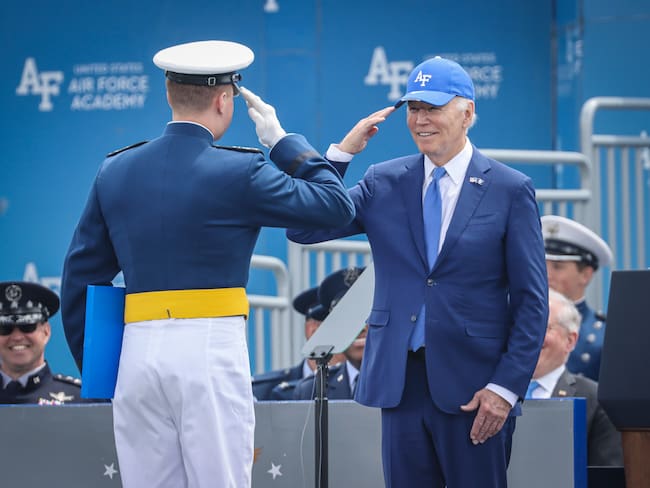 COLORADO SPRINGS, COLORADO - JUNE 1: President Joe Biden salutes an Air Force Academy cadet during graduation on June 1, 2023 at Falcon Stadium on the U.S. Air Force Academy in Colorado Springs, Colorado. The event featured the graduation of 921 Air Force cadets and a commencement address by President Biden. (Photo by Marc Piscotty/Getty Images)