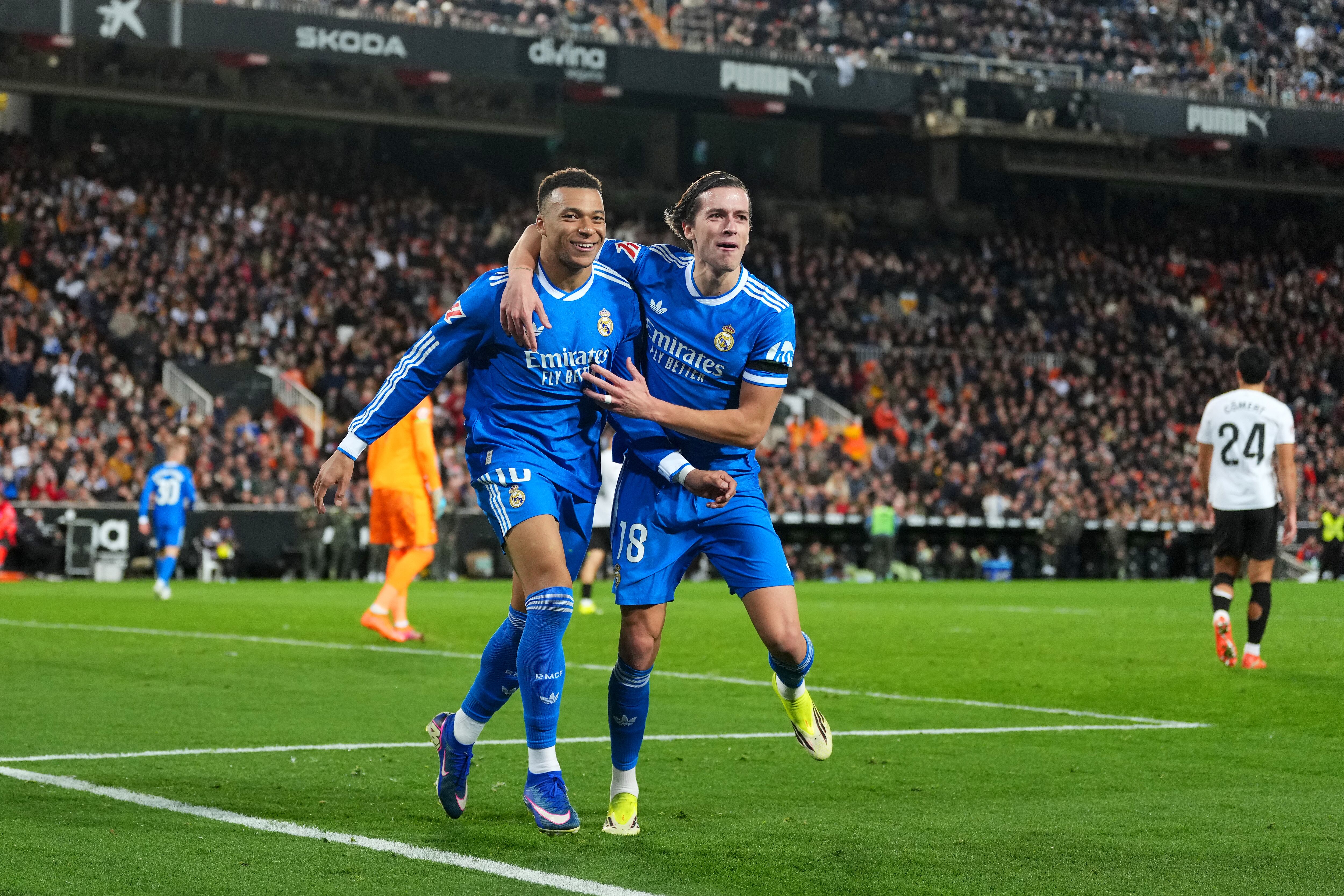 VALENCIA, SPAIN - FEBRUARY 08: Kylian Mbappe of Real Madrid celebrates scoring his team's second goal with Alvaro Carreras during the LaLiga EA Sports match between Valencia CF and Real Madrid CF at Estadi de Mestalla on February 08, 2026 in Valencia, Spain. (Photo by Aitor Alcalde/Getty Images)
