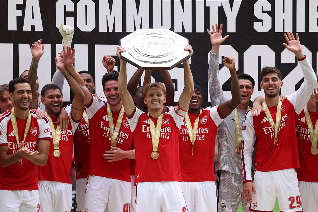 CARDIFF, WALES - AUGUST 16: Martin Odegaard of Arsenal lifts the trophy as the team celebrate  the 2026 FA Community Shield match between Arsenal and Manchester City at Principality Stadium on August 16, 2026 in Cardiff, Wales. (Photo by Catherine Ivill - AMA/Getty Images)