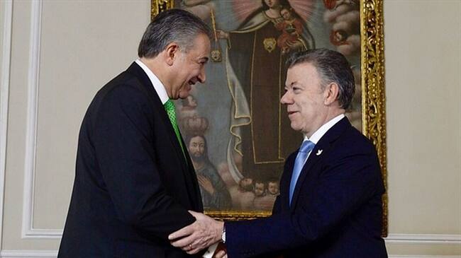 Óscar Naranjo y Juan Manuel Santos. Foto: Colprensa