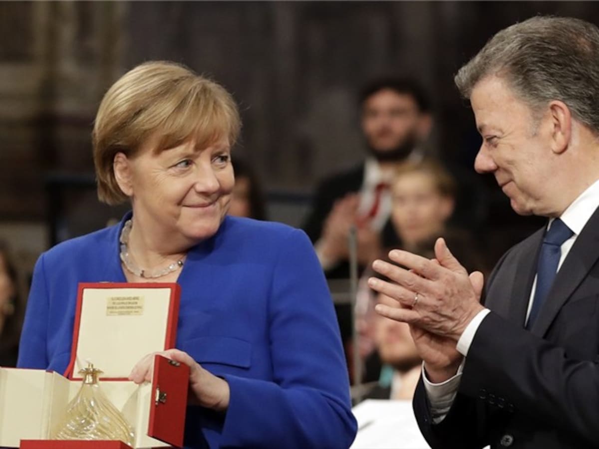 Usted hizo historia en Colombia por la conciliación: Merkel a Santos