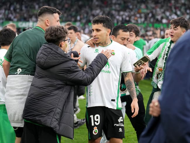 DONOSTIA, SPAIN - MAY 16: Fans of Real Racing Club de Santander celebrate with Gustavo Puerta on the pitch after securing promotion following victory in the LaLiga Hypermotion match between Real Racing Club de Santander and Real Valladolid CF at Campos de Sport de El Sardinero on May 16, 2026 in Donostia, Spain. (Photo by Juan Manuel Serrano Arce/Getty Images)