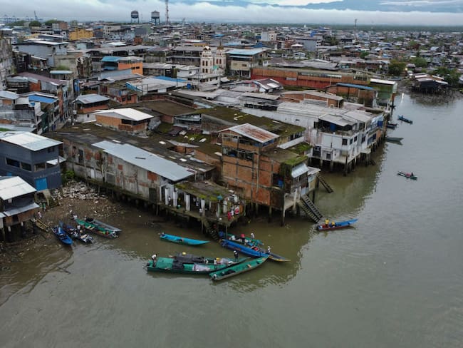 Aerial view of the port city of Buenaventura, Colombia, on December 8, 2022. - Colombia&#039;s President Gustavo Petro supported on Wednesday the &quot;peace process&quot; carried out by two rival gangs in the convulsed port of Buenaventura, while the government explores submission agreements with drug organizations in exchange for judicial benefits. According to the government, the city completes 85 days without homicides or confrontations between gang members. (Photo by JOAQUIN SARMIENTO / AFP) (Photo by JOAQUIN SARMIENTO/AFP via Getty Images)