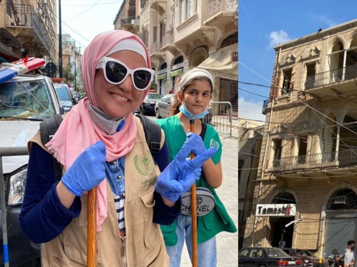 Jóvenes ayudan a levantar escombros en las calles de Beirut tras la explosión