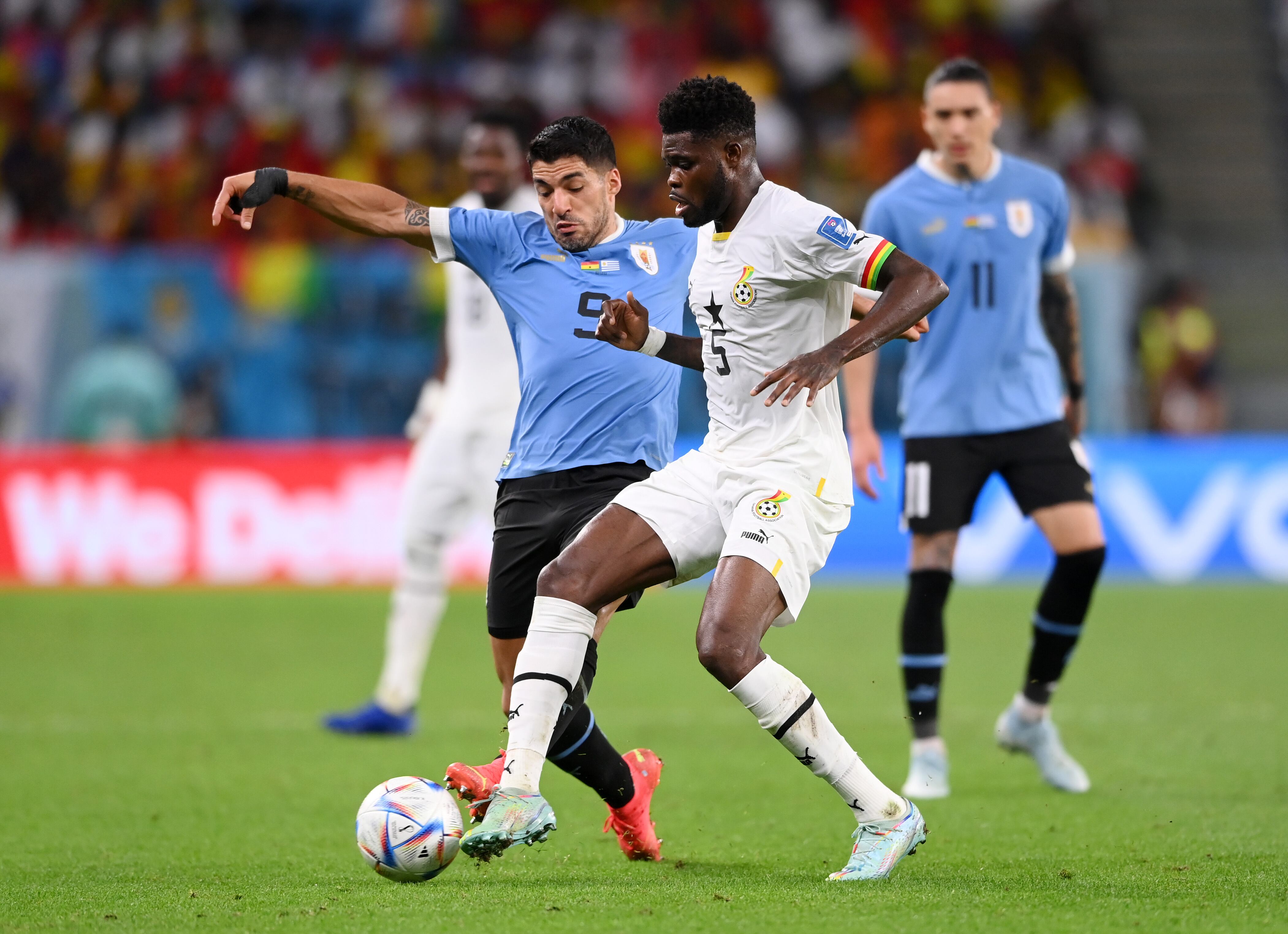 AL WAKRAH, QATAR - DECEMBER 02: Thomas Partey of Ghana battles for possession with Luis Suarez of Uruguay during the FIFA World Cup Qatar 2022 Group H match between Ghana and Uruguay at Al Janoub Stadium on December 02, 2022 in Al Wakrah, Qatar. (Photo by Stu Forster/Getty Images)