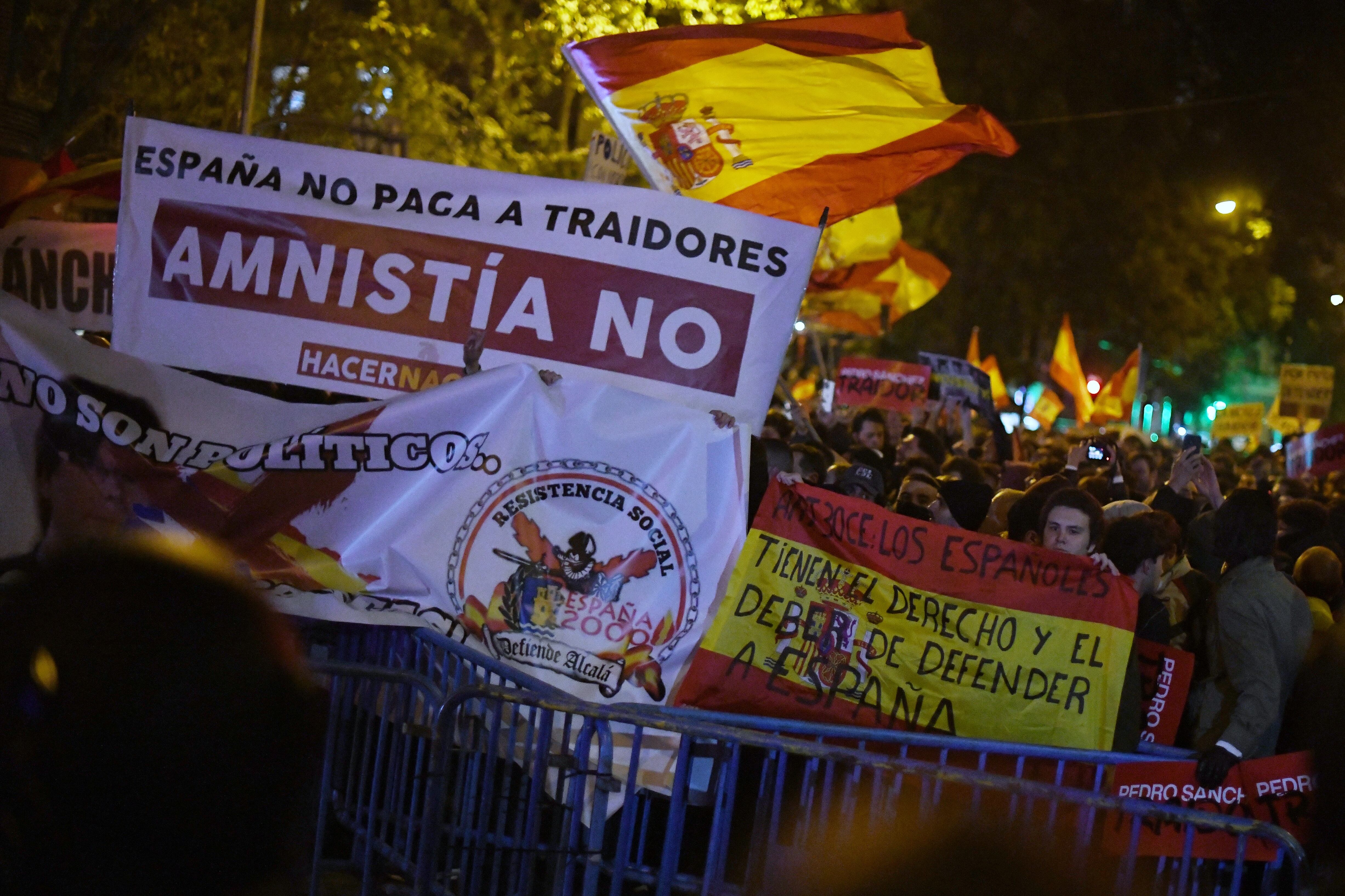 MADRID, SPAIN - NOVEMBER 07: Dozens of people with flags and banners during a rally against the amnesty, in front of the PSOE headquarters in Ferraz street, on November 7, 2023, in Madrid, Spain. The demonstrators have shown their opposition to the pact of the Socialists with ERC that includes, among other measures, an amnesty law that would favor the accused of the Catalan 'proces', the transfer of the competences of Rodalies or the cancellation of up to 15,000 million euros of debt of the Autonomous Liquidity Fund (FLA) to Catalonia. (Photo By Fernando Sanchez/Europa Press via Getty Images)