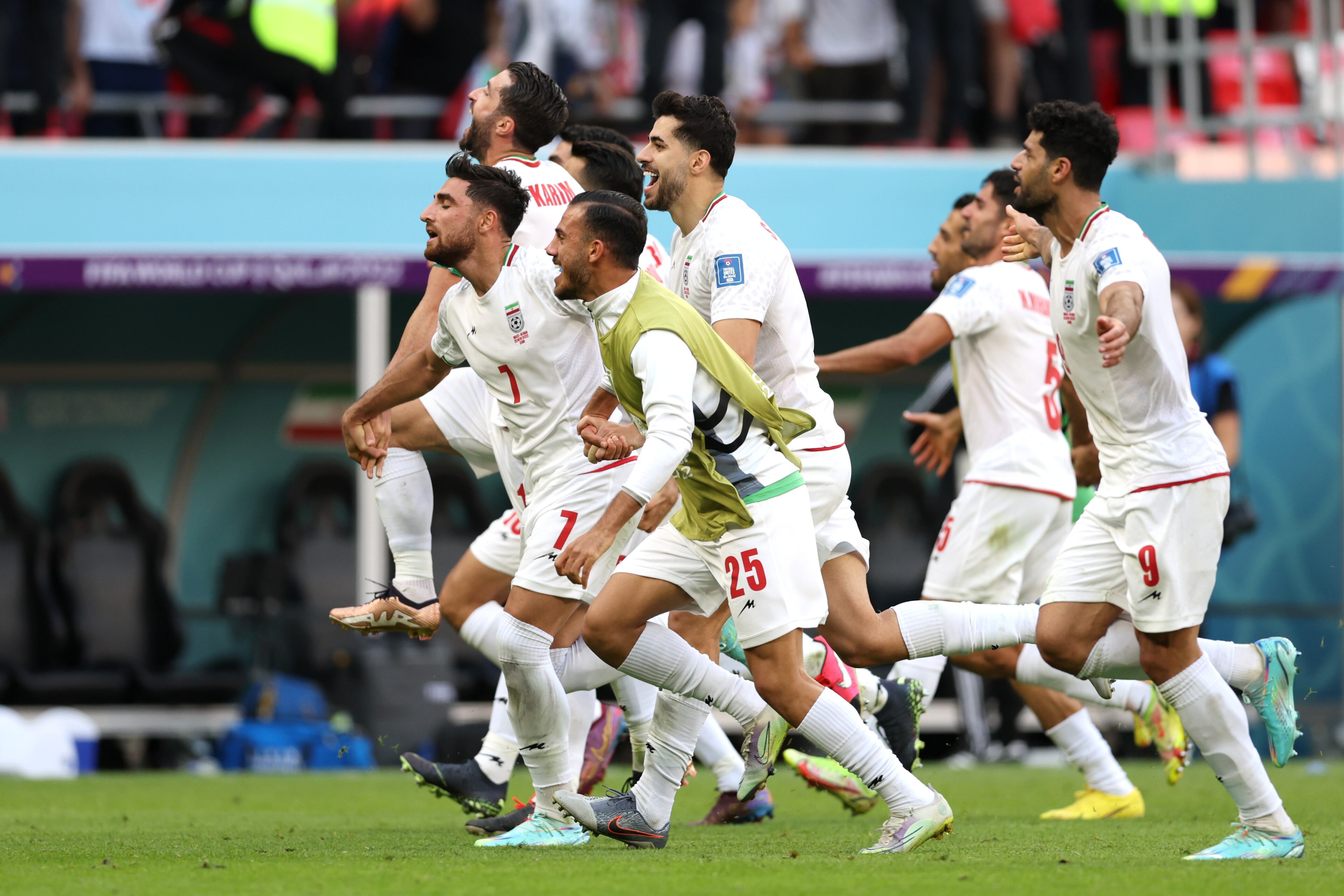 DOHA, QATAR - NOVEMBER 25: IR Iran players celebrate after the 2-0 win during the FIFA World Cup Qatar 2022 Group B match between Wales and IR Iran at Ahmad Bin Ali Stadium on November 25, 2022 in Doha, Qatar. (Photo by Clive Brunskill/Getty Images)