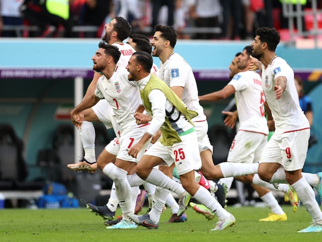 DOHA, QATAR - NOVEMBER 25: IR Iran players celebrate after the 2-0 win during the FIFA World Cup Qatar 2022 Group B match between Wales and IR Iran at Ahmad Bin Ali Stadium on November 25, 2022 in Doha, Qatar. (Photo by Clive Brunskill/Getty Images)
