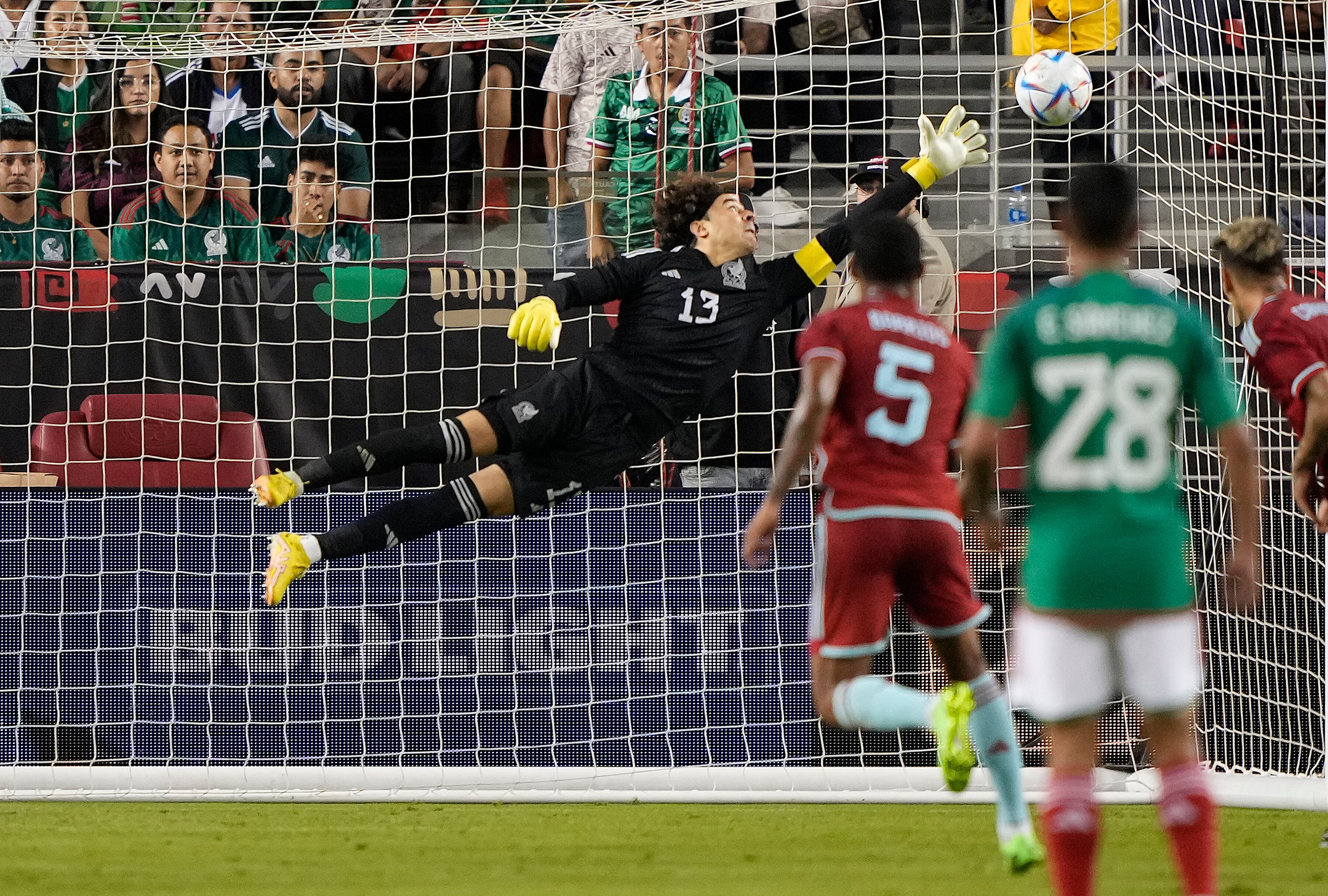 SANTA CLARA, CALIFORNIA - SEPTEMBER 27:  Wilmar Barrios #5 of Colombia scores a goal past goal keeper Guillermo Ochoa #13 of Mexico in the second half of the Mextour Send Off at Levi's Stadium on September 27, 2022 in Santa Clara, California. Colombia won the game 3-2. (Photo by Thearon W. Henderson/Getty Images)