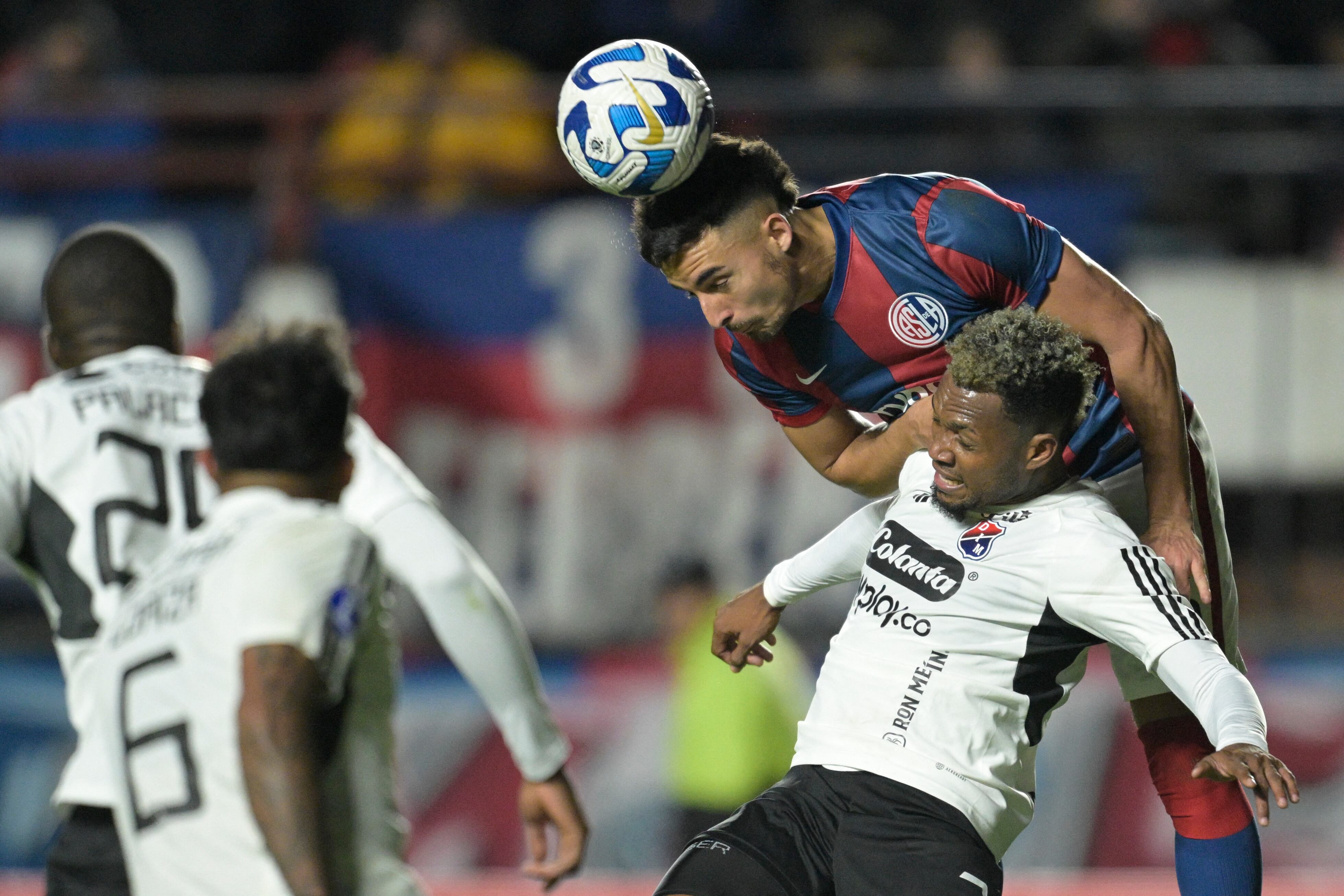 Independiente Medellin's defender Leyser Chaverra (Front) and San Lorenzo's defender Gonzalo Lujan (Back) fight for the ball during the Copa Sudamericana round of 32 knockout play-offs second leg football match between Argentina's San Lorenzo and Colombia's Independiente Medellin at the Pedro Bidegain stadium in Buenos Aires on July 19, 2023. (Photo by JUAN MABROMATA / AFP) (Photo by JUAN MABROMATA/AFP via Getty Images)