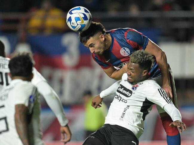 Independiente Medellin's defender Leyser Chaverra (Front) and San Lorenzo's defender Gonzalo Lujan (Back) fight for the ball during the Copa Sudamericana round of 32 knockout play-offs second leg football match between Argentina's San Lorenzo and Colombia's Independiente Medellin at the Pedro Bidegain stadium in Buenos Aires on July 19, 2023. (Photo by JUAN MABROMATA / AFP) (Photo by JUAN MABROMATA/AFP via Getty Images)