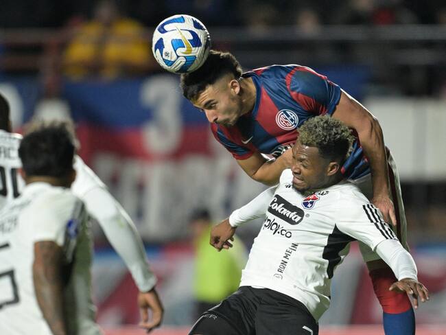 Independiente Medellin's defender Leyser Chaverra (Front) and San Lorenzo's defender Gonzalo Lujan (Back) fight for the ball during the Copa Sudamericana round of 32 knockout play-offs second leg football match between Argentina's San Lorenzo and Colombia's Independiente Medellin at the Pedro Bidegain stadium in Buenos Aires on July 19, 2023. (Photo by JUAN MABROMATA / AFP) (Photo by JUAN MABROMATA/AFP via Getty Images)
