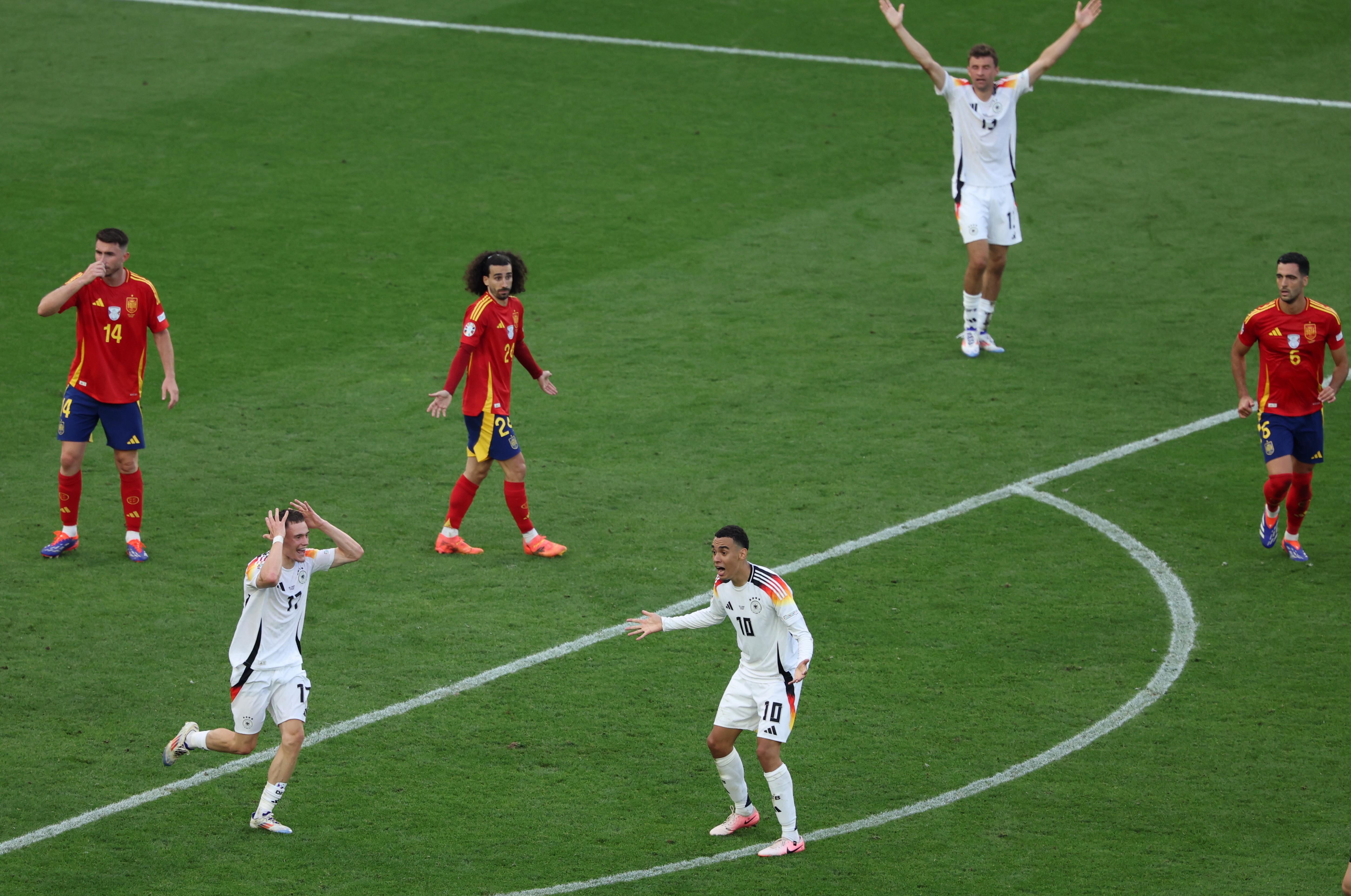 Stuttgart (Germany), 05/07/2024.- Marc Cucurella of Spain Players of Germany and Marc Cucurella (C) of Spain react during the UEFA EURO 2024 quarter-finals soccer match between Spain and Germany, in Stuttgart, Germany, 05 July 2024. (Alemania, España) EFE/EPA/GEORGI LICOVSKI