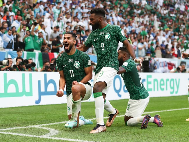 LUSAIL CITY, QATAR - NOVEMBER 22: Saleh Al-Shehri of Saudi Arabia celebrates with his team mates after scoring a goal to make it 1-1 during the FIFA World Cup Qatar 2022 Group C match between Argentina and Saudi Arabia at Lusail Stadium on November 22, 2022 in Lusail City, Qatar. (Photo by James Williamson - AMA/Getty Images)