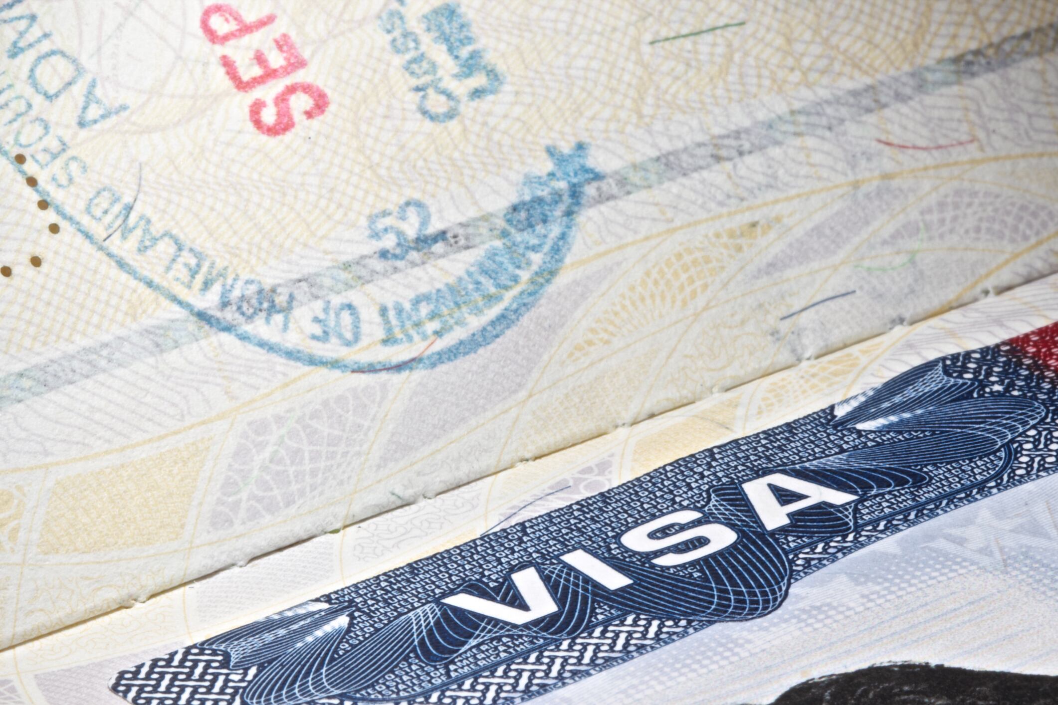 Detail of an USA VISA plus a partial stamp