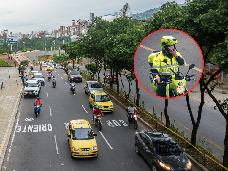 Vía de Bucaramanga y al lado un Policía de Colombia (Fotos vía Getty Images)