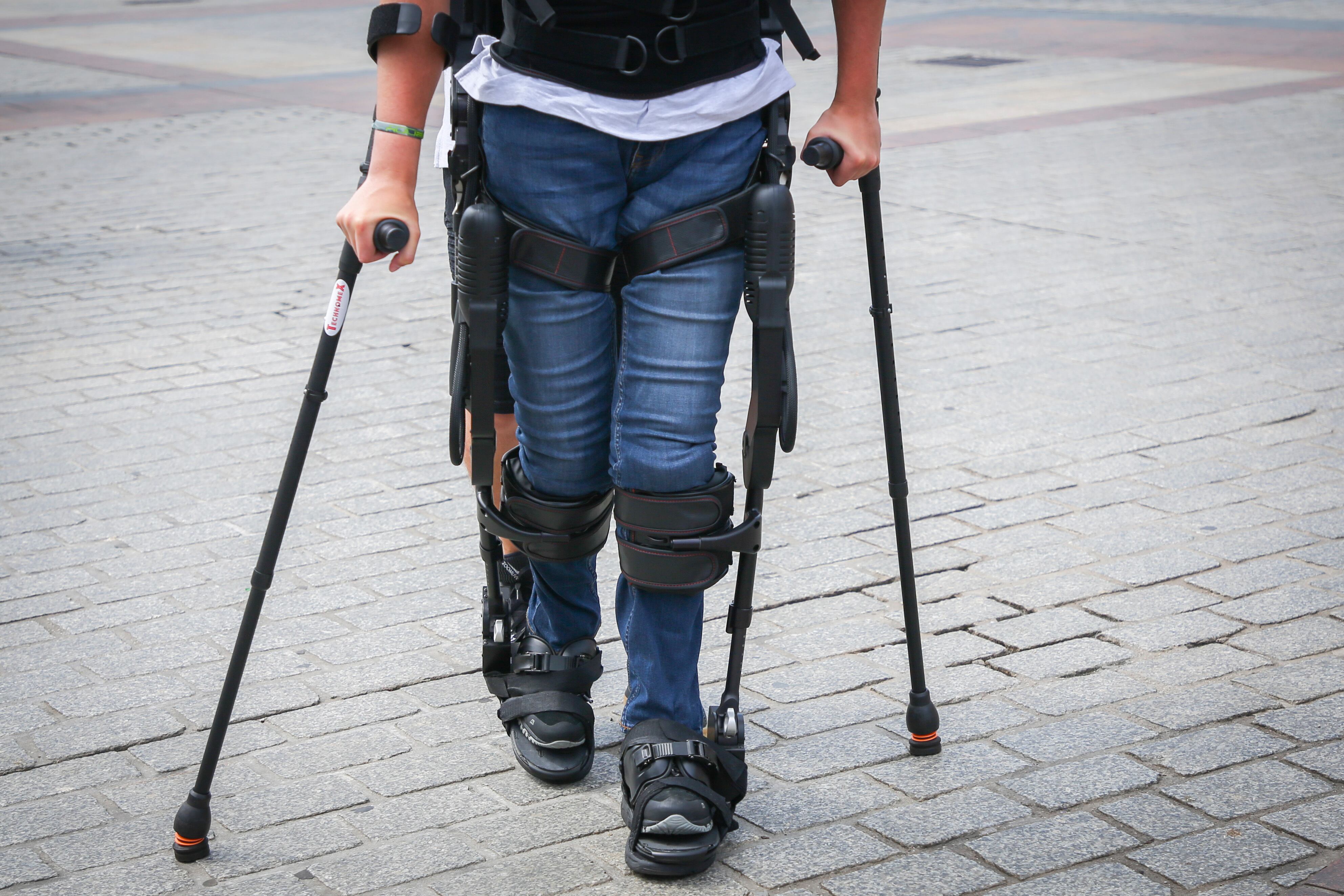 A paraplegic young man Marcin walks throught the Main Square during a demonstration of exoskeleton. Krakow, Poland on 1 August, 2018.  (Photo by Beata Zawrzel/NurPhoto via Getty Images)