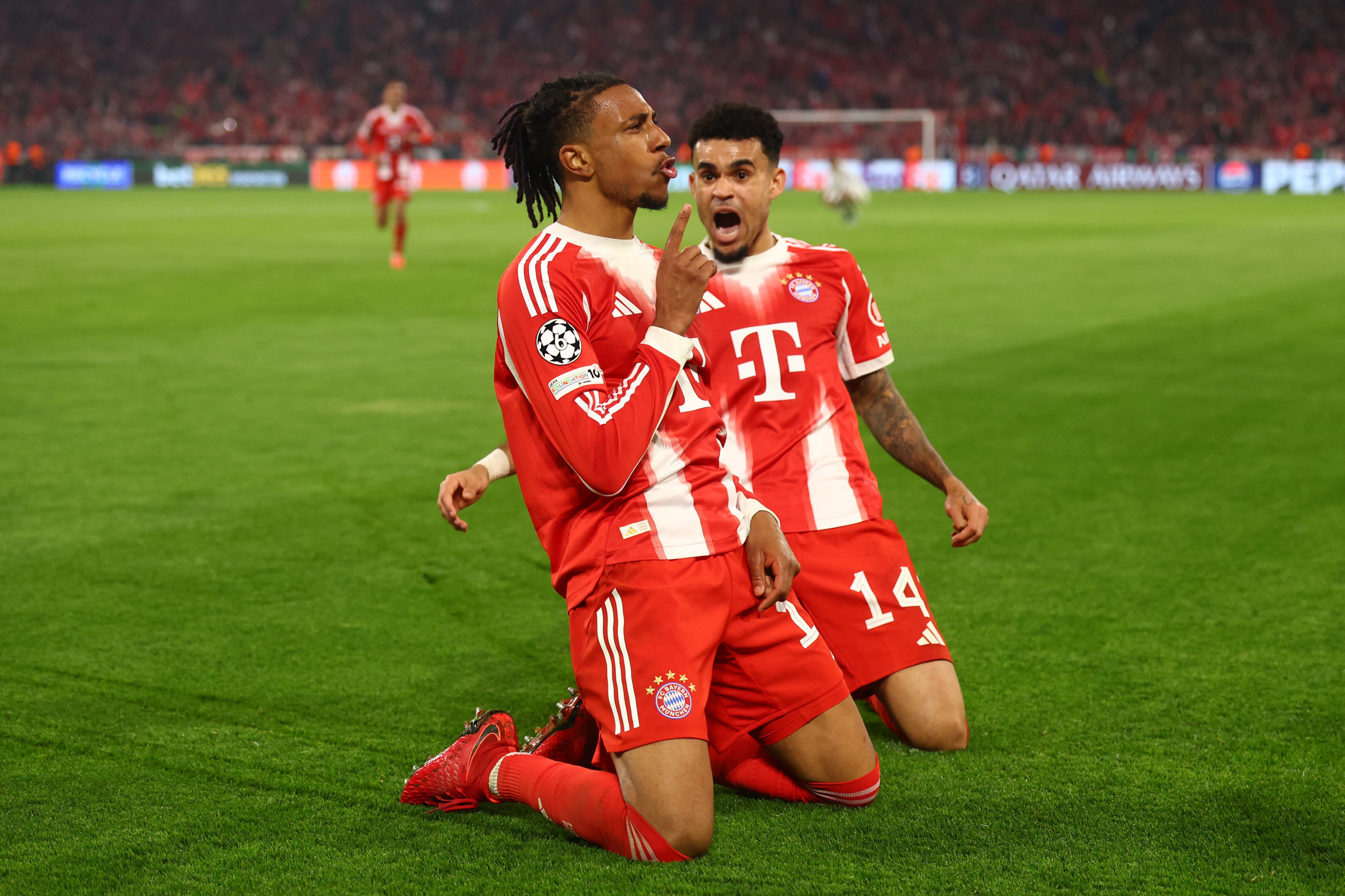 MUNICH, GERMANY - APRIL 15:   Michael Olise of Bayern Munich celebrates scoring a goal to make the score 4-3 with his team-mate Luis Diaz during the UEFA Champions League 2025/26 Quarter-Final Second Leg match between FC Bayern M¸nchen and Real Madrid CF at Football Arena Munich on April 15, 2026 in Munich, Germany. (Photo by Chris Brunskill/Fantasista/Getty Images)