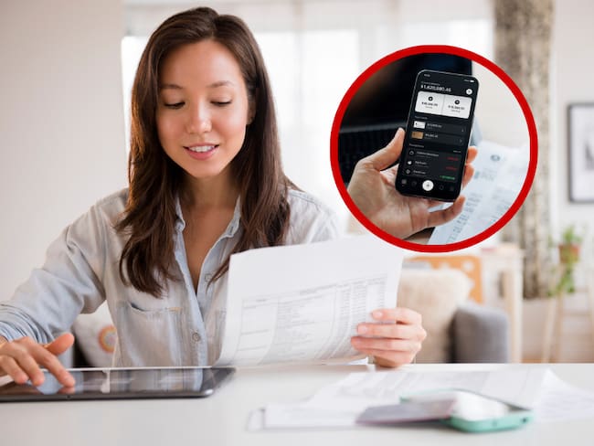 Open Finance // Persona mirando unos papeles // Celular con aplicación bancaria // Getty Images