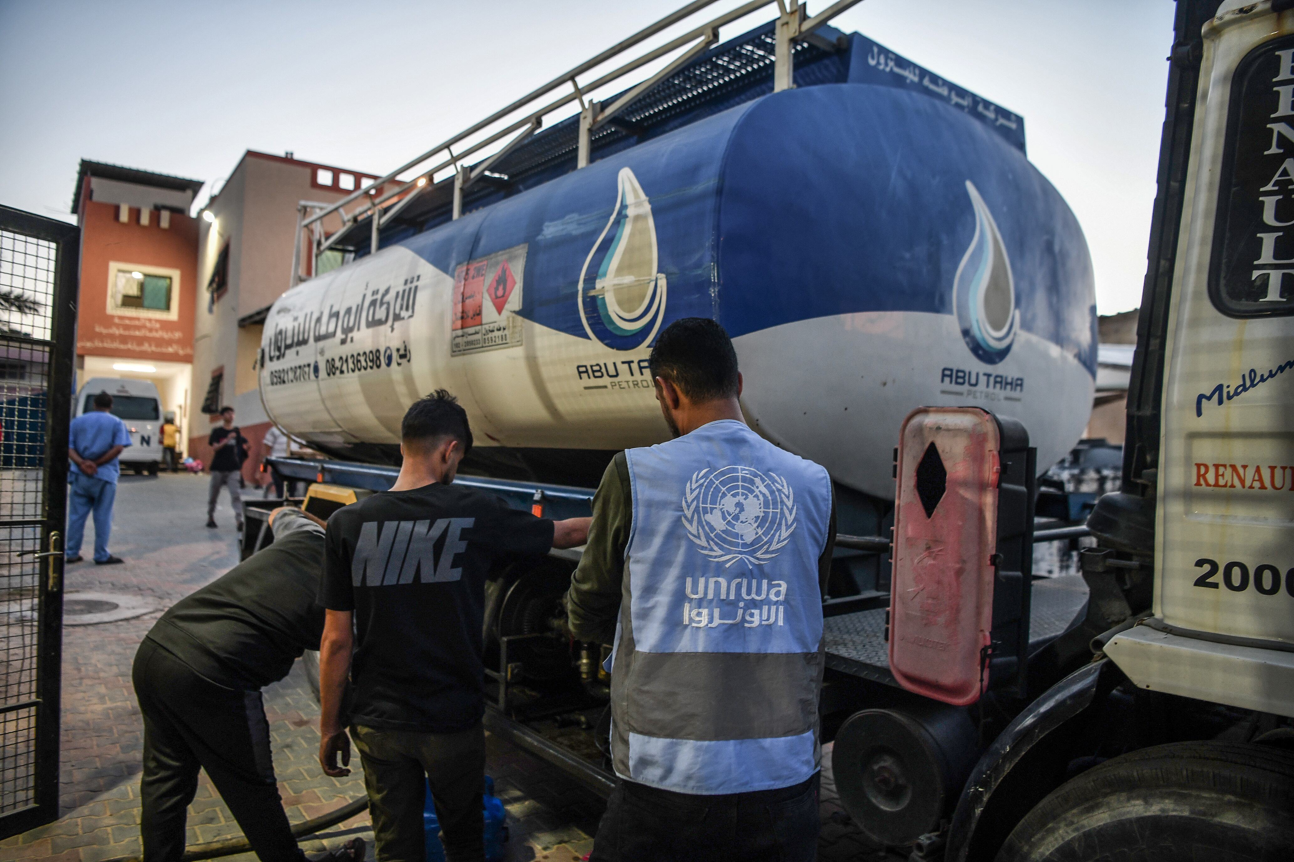 KHAN YUNIS, GAZA - NOVEMBER 10: Officials of the United Nations (UN) Relief and Works Agency for Palestine Refugees in the Near East (UNRWA) bring fuel to solve fuel shortage at Al-Nasr Hospital in Khan Yunis, Gaza on November 10, 2023. Hospitals in the Gaza Strip, which under heavy bombardment for 35 days, are trying to continue surgery and treatment services with primitive methods due to fuel shortage. (Photo by Abed Zagout/Anadolu via Getty Images)